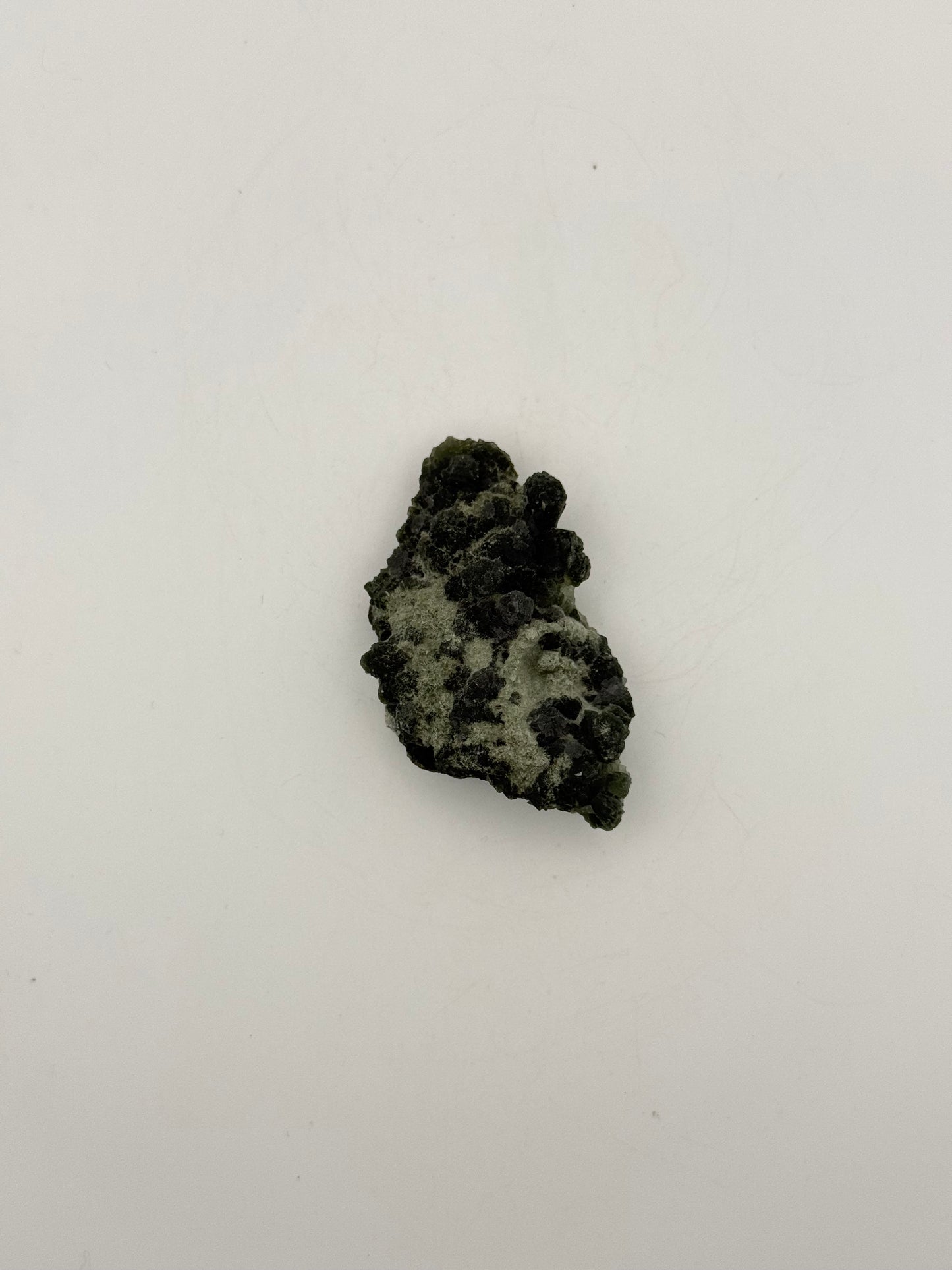 Raw prehnite specimen with amazing green color.