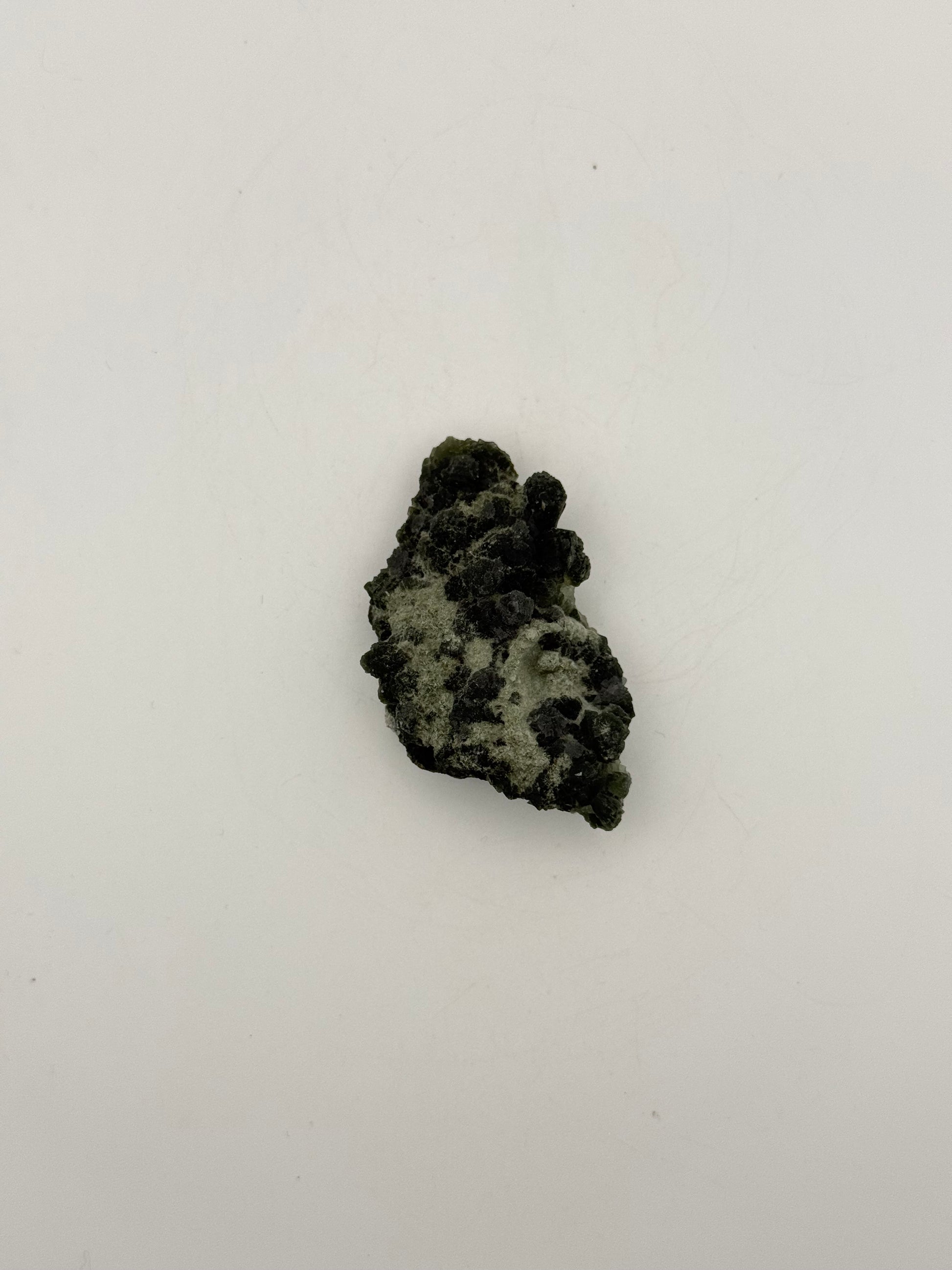 Raw prehnite specimen with amazing green color.