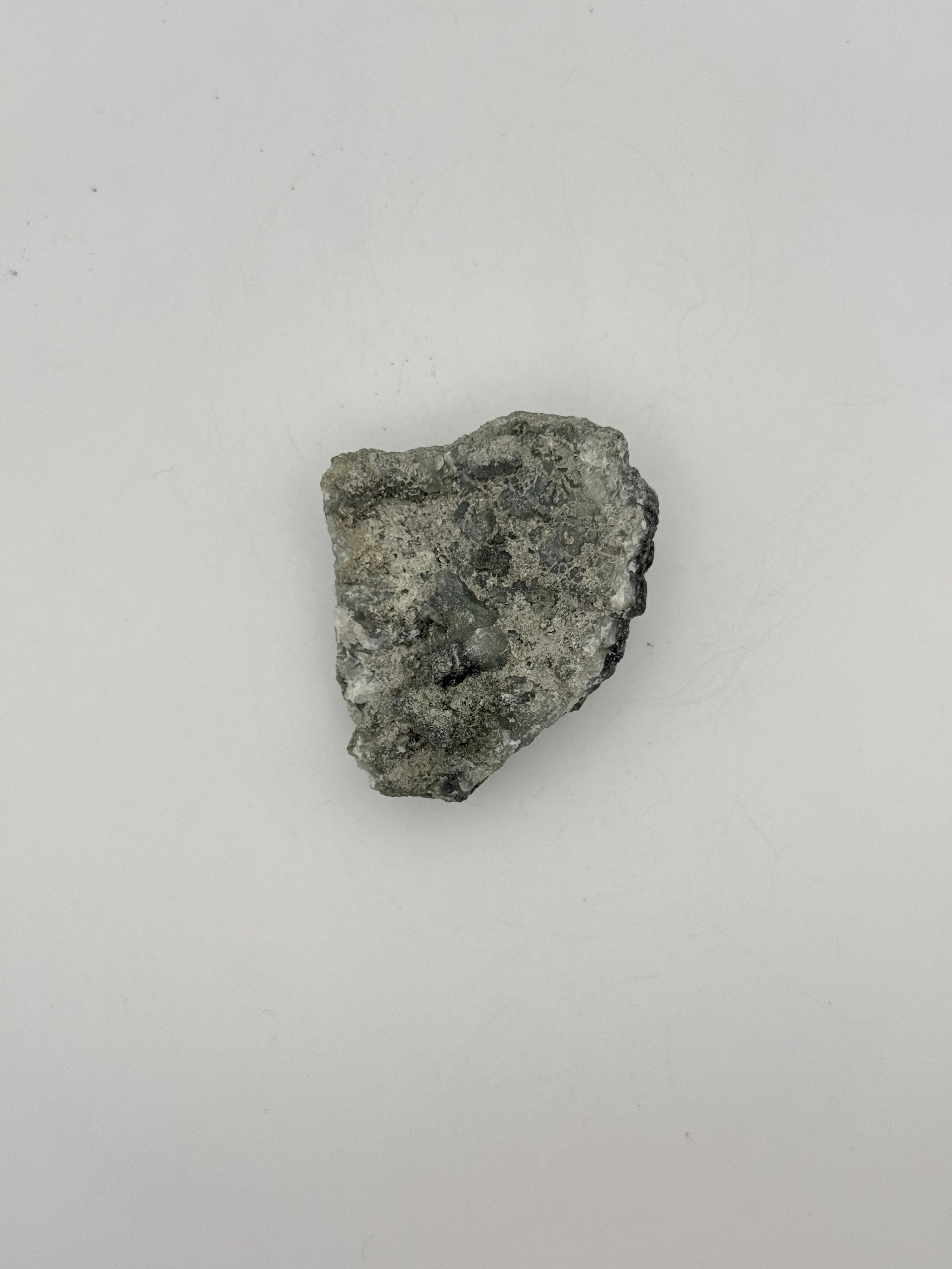 Raw prehnite specimen with amazing green color.