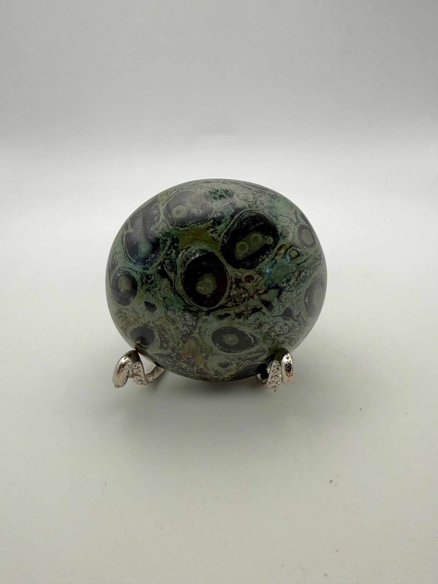 Polished kambaba jasper palm stone.