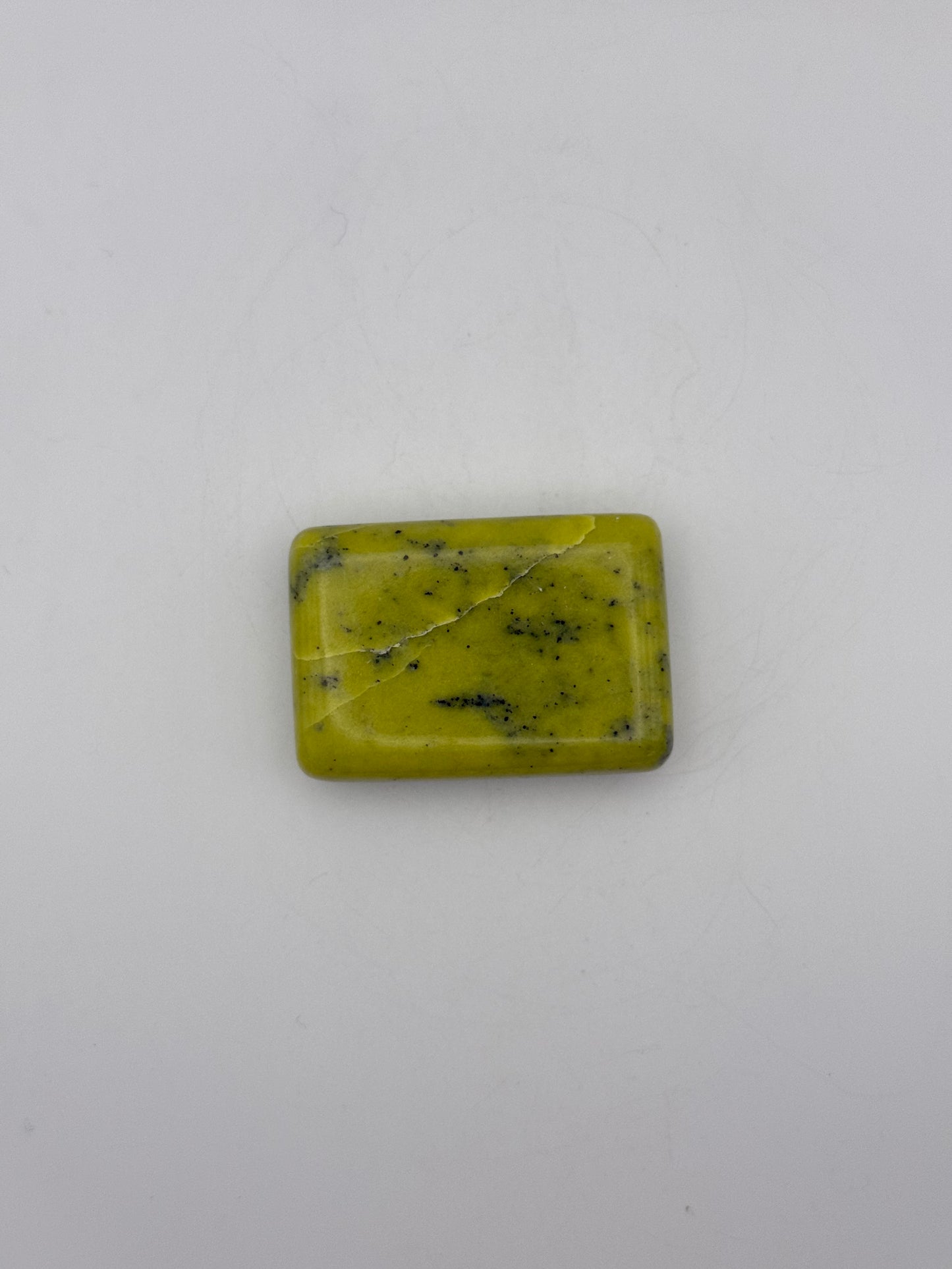 Polished healerite in the shape of a rectangular soap.