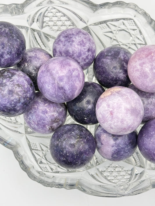 Polished Lepidolite spheres about 30mm in size.
