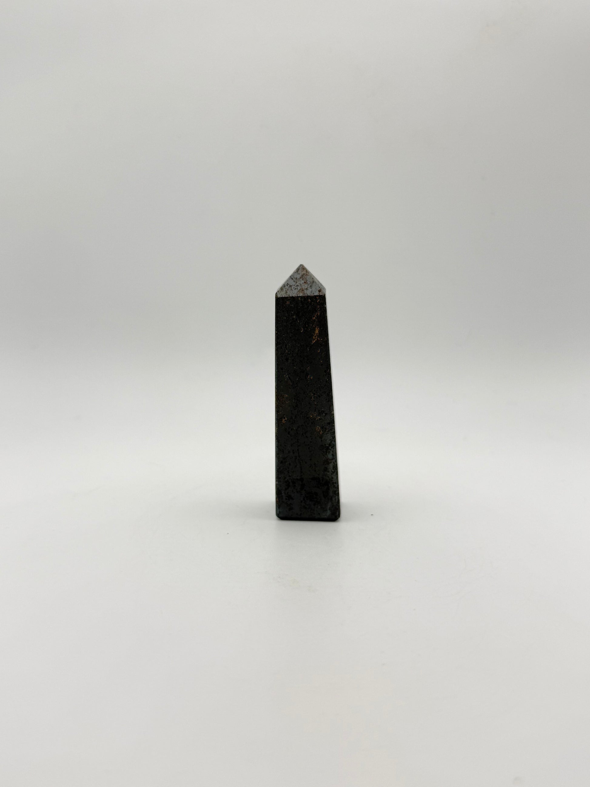 four sided hematite tower.