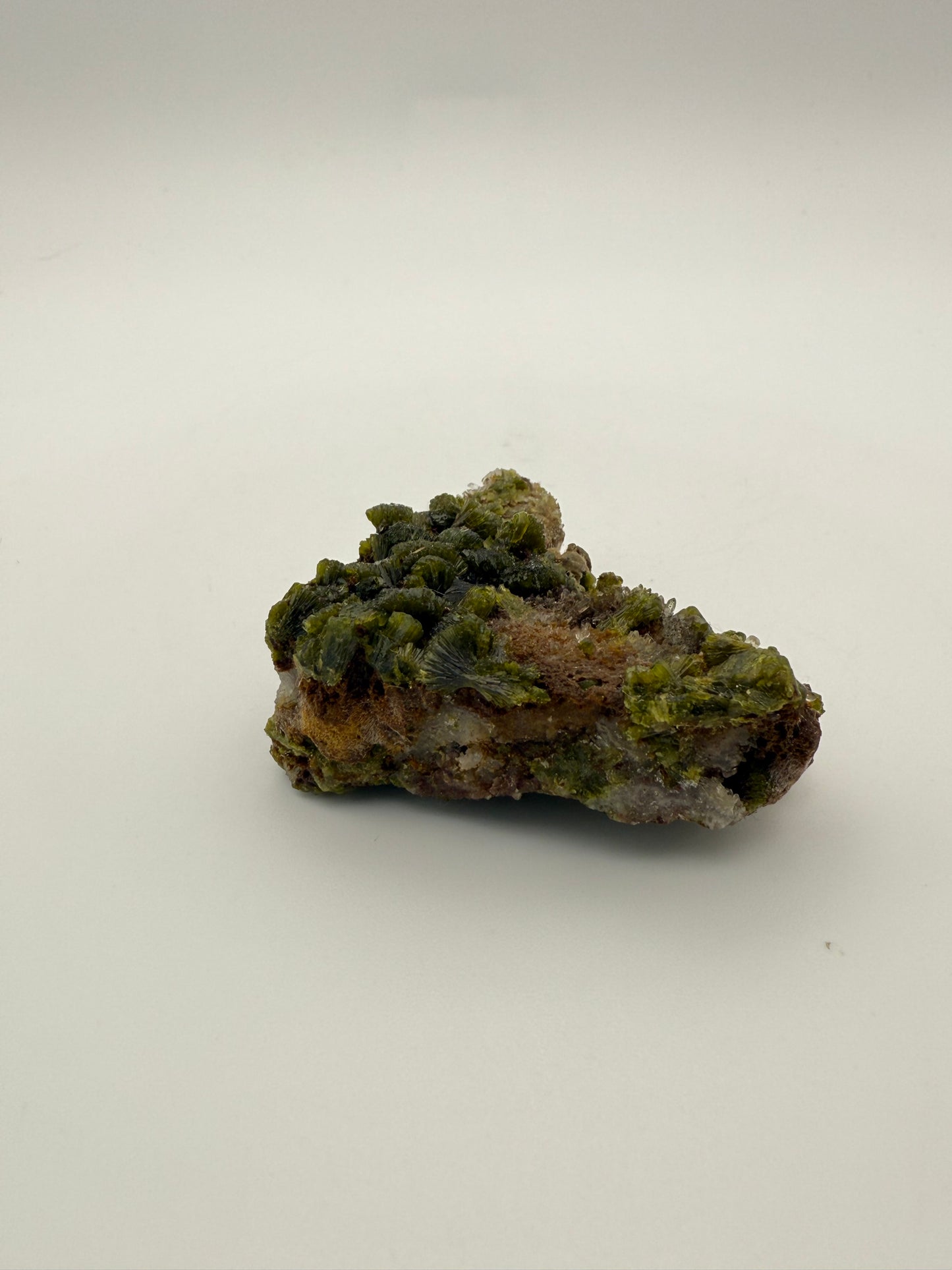 Epidote crystal cluster with good green color.