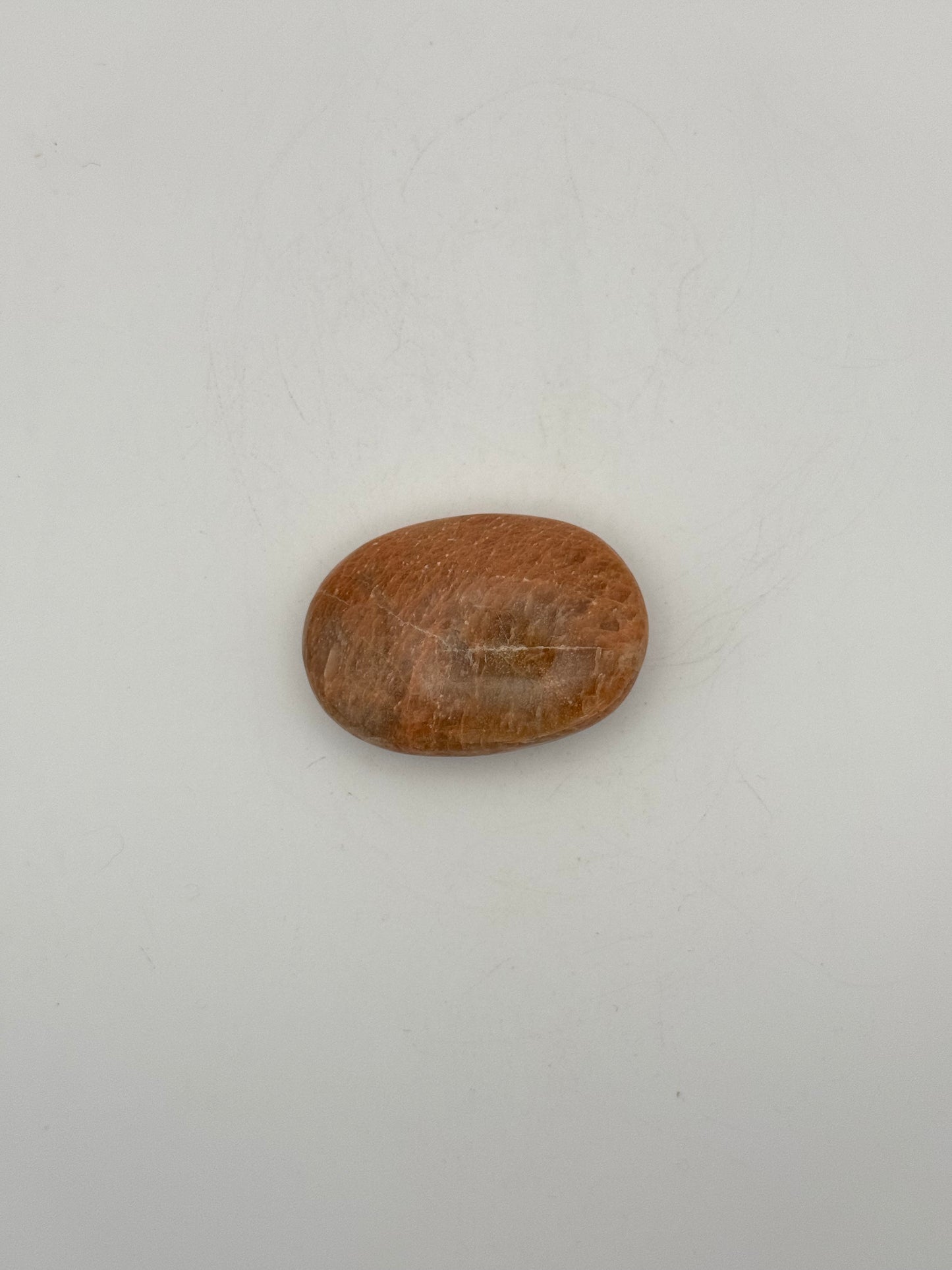 Polished Peach moonstone palm stone.