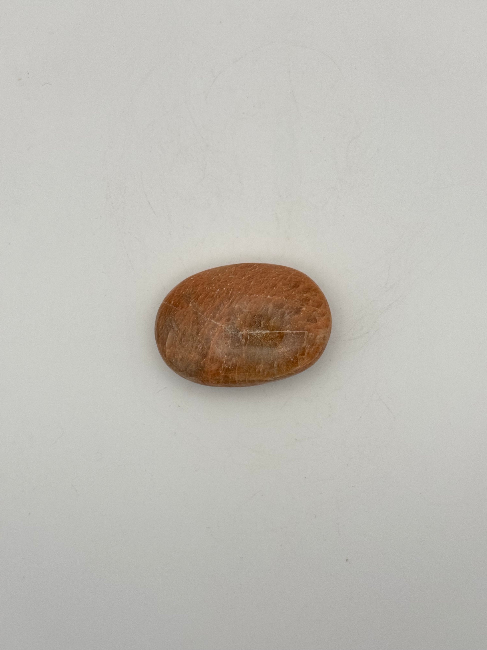 Polished Peach moonstone palm stone.
