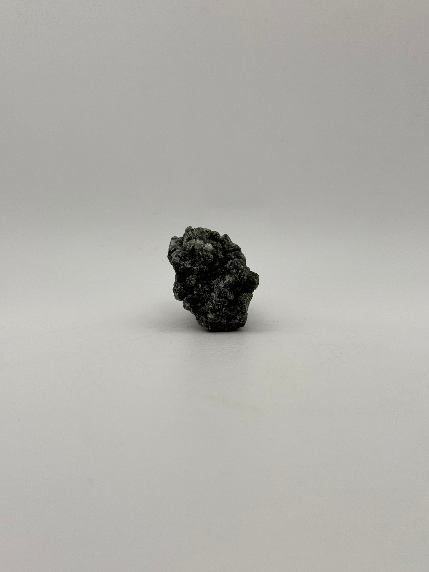 Raw prehnite specimen with amazing green color.