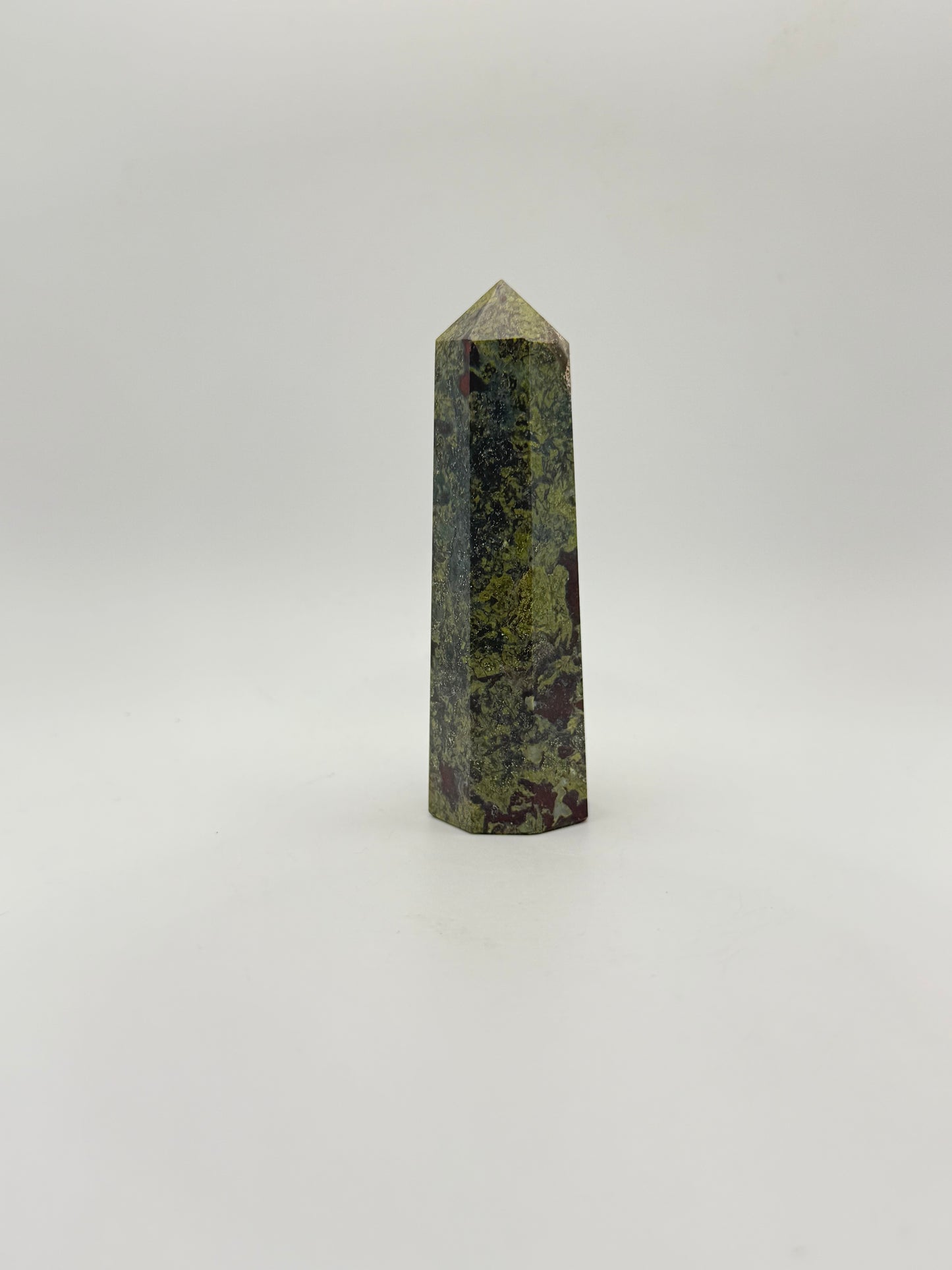 Polished Dragon Bloodstone in the shape of a tower.