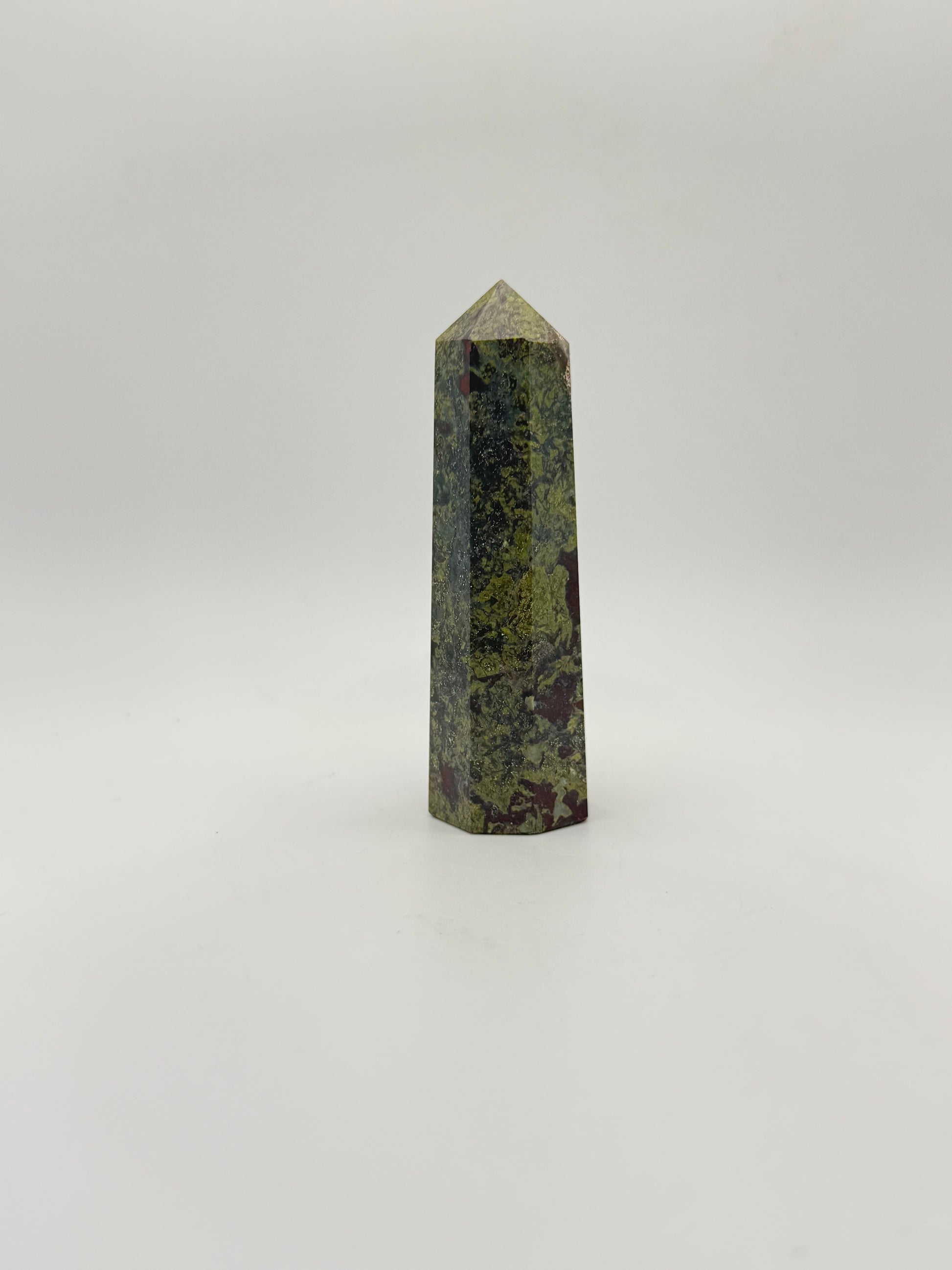 Polished Dragon Bloodstone in the shape of a tower.