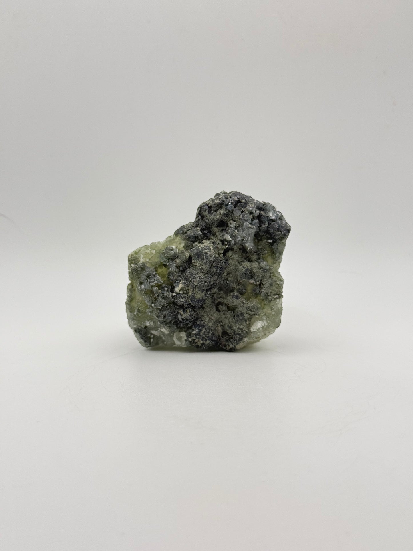 Raw Prehnite specimen with amazing green color.