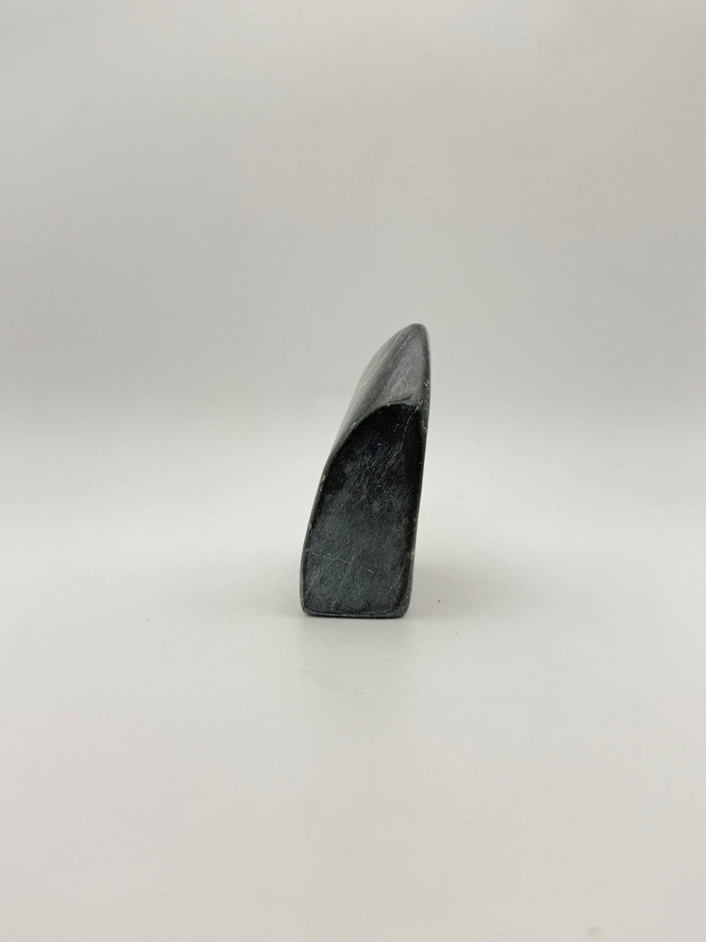 Polished green jade free form.