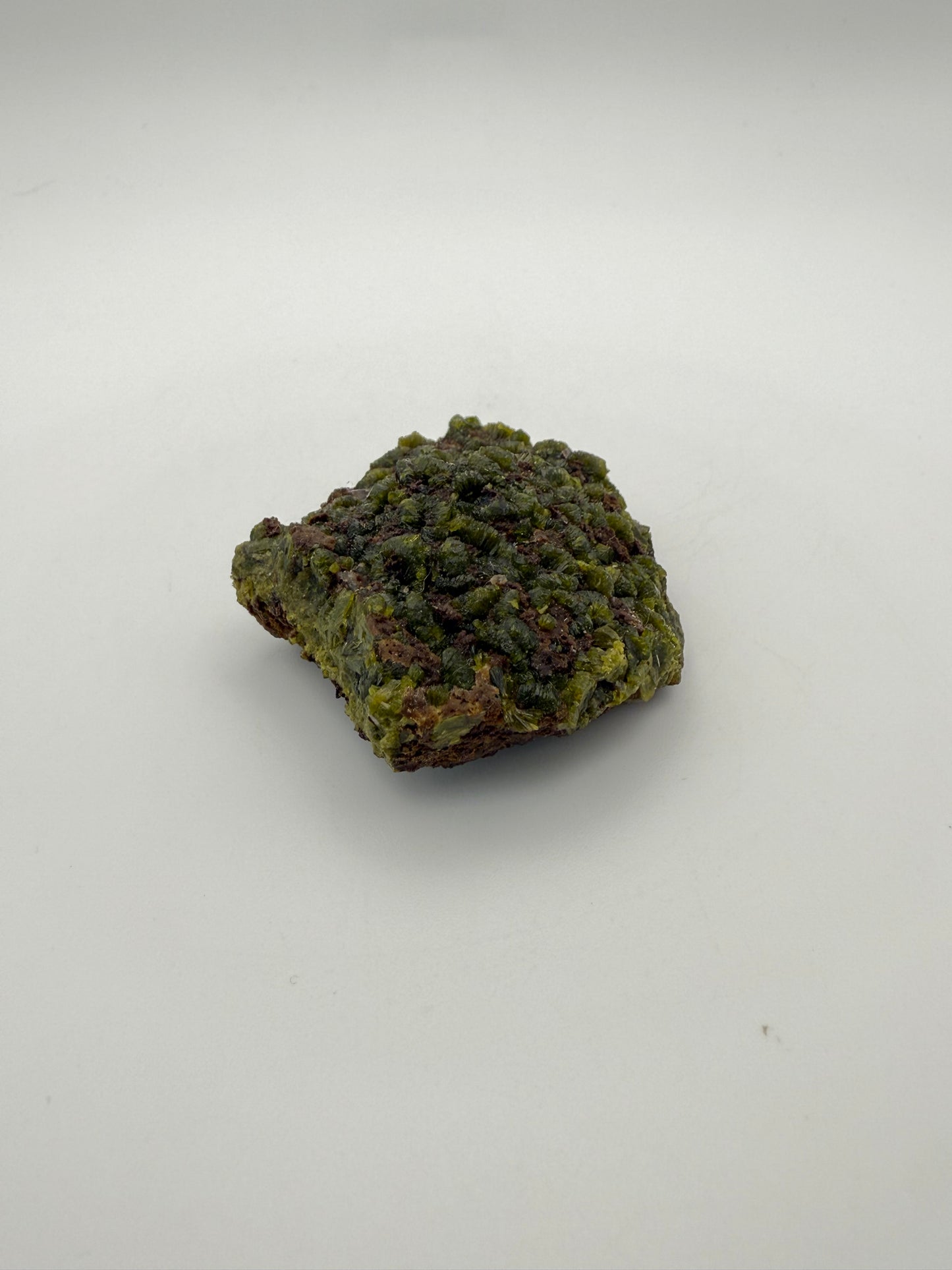 Epidote crystal cluster with good green color.
