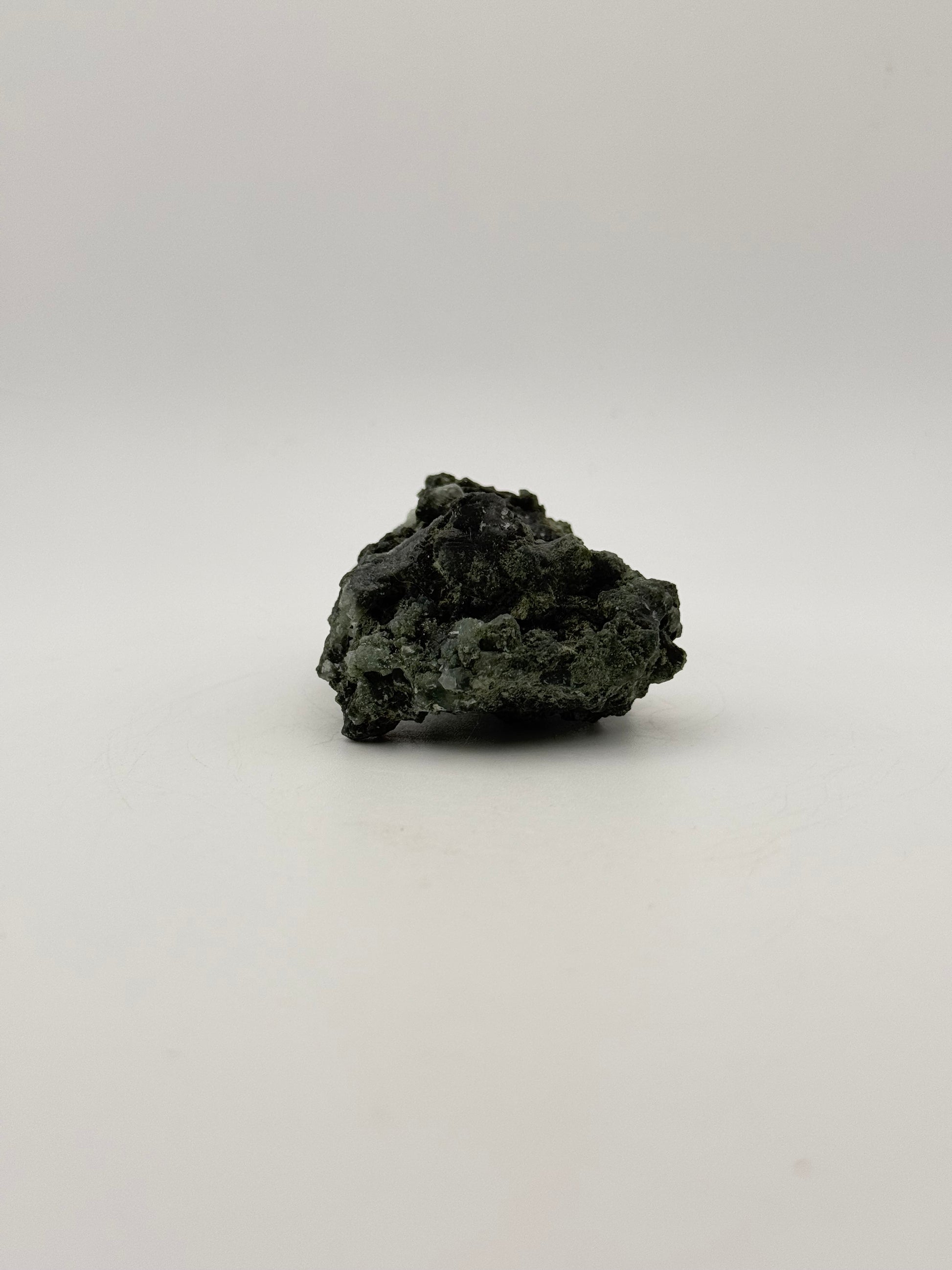 Raw Prehnite specimen with amazing green color.