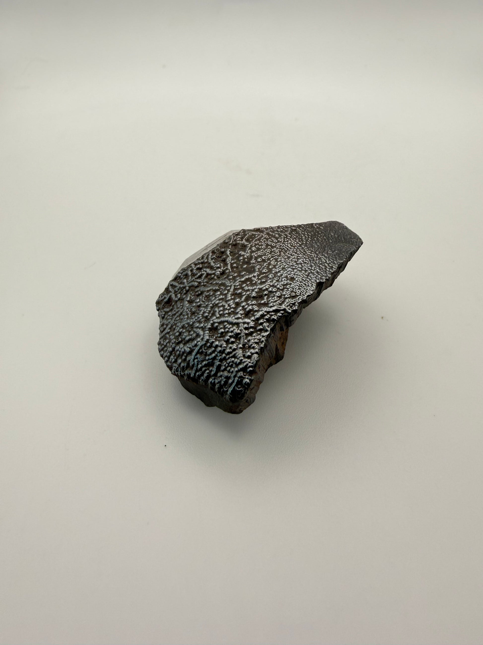 Small raw hematite specimen.
