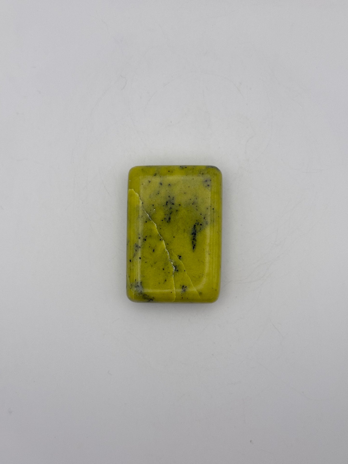 Polished healerite in the shape of a rectangular soap.