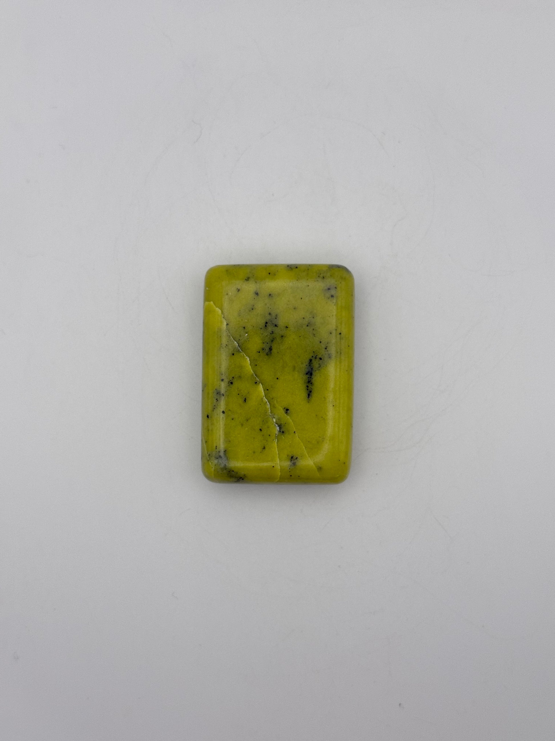 Polished healerite in the shape of a rectangular soap.