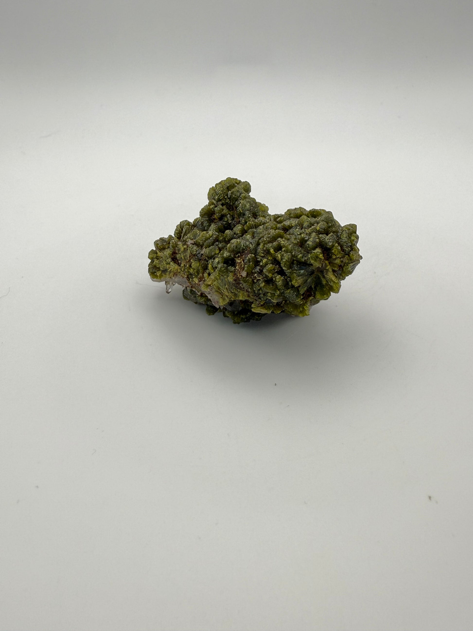 Epidote crystal cluster with good green color.