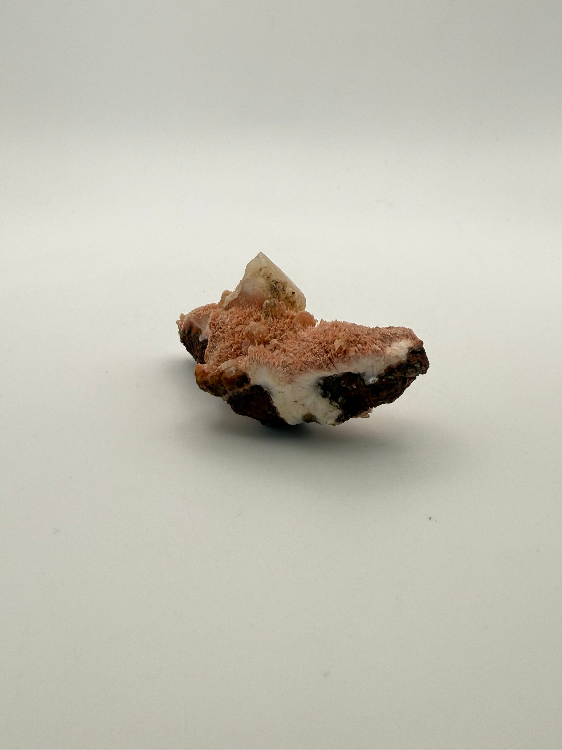 Raw Messolite crystal.