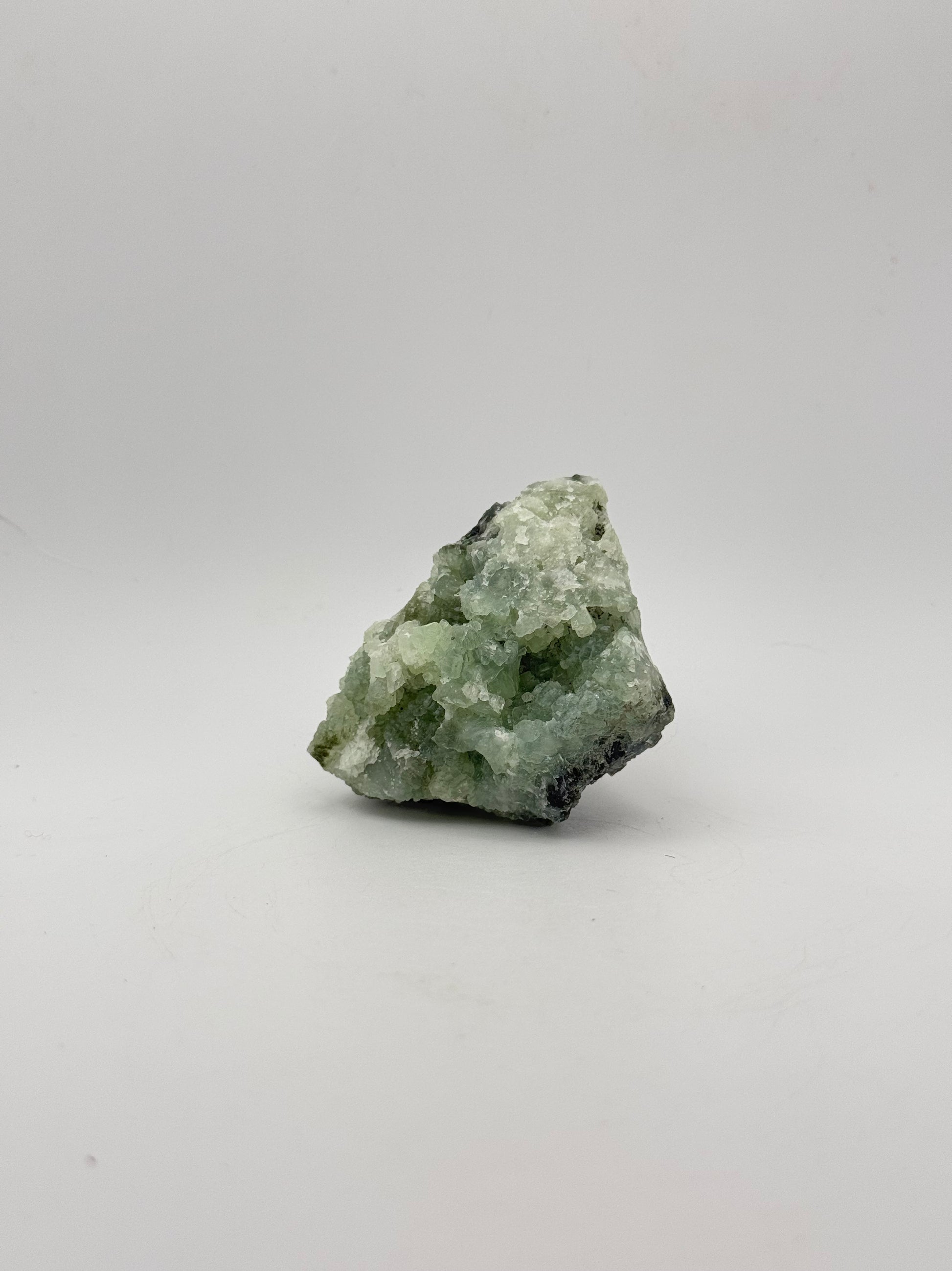 Raw Prehnite specimen with amazing green color.