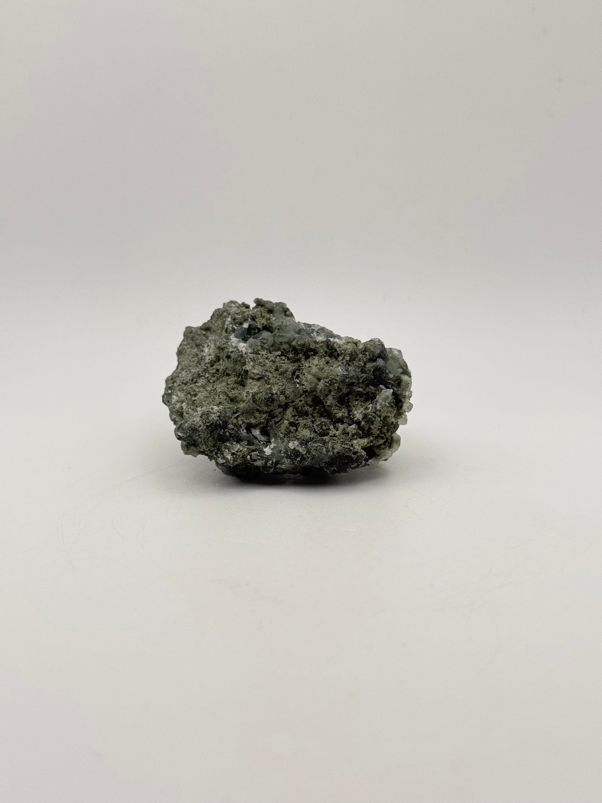 Raw Prehnite specimen with amazing green color.