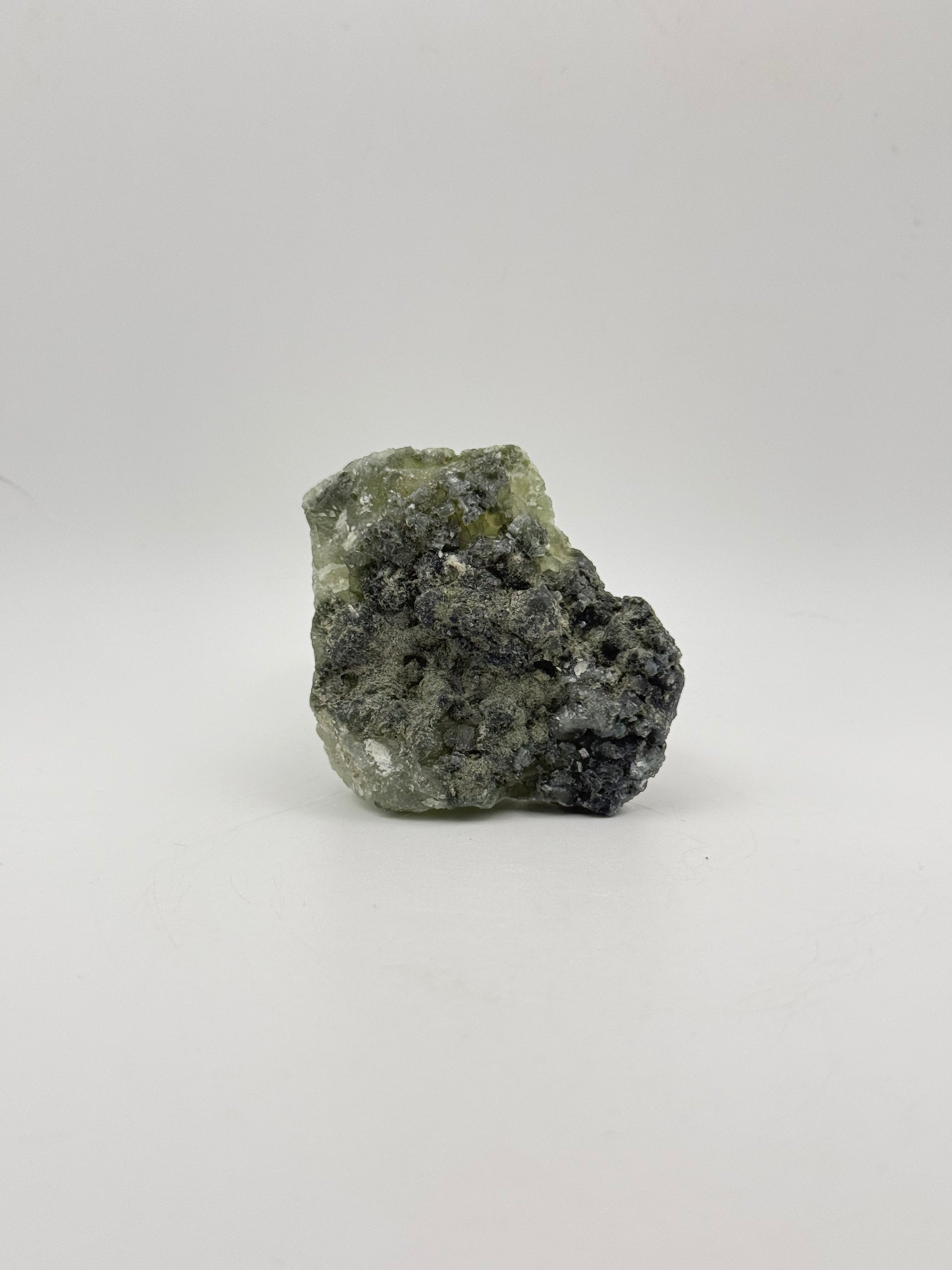 Raw Prehnite specimen with amazing green color.