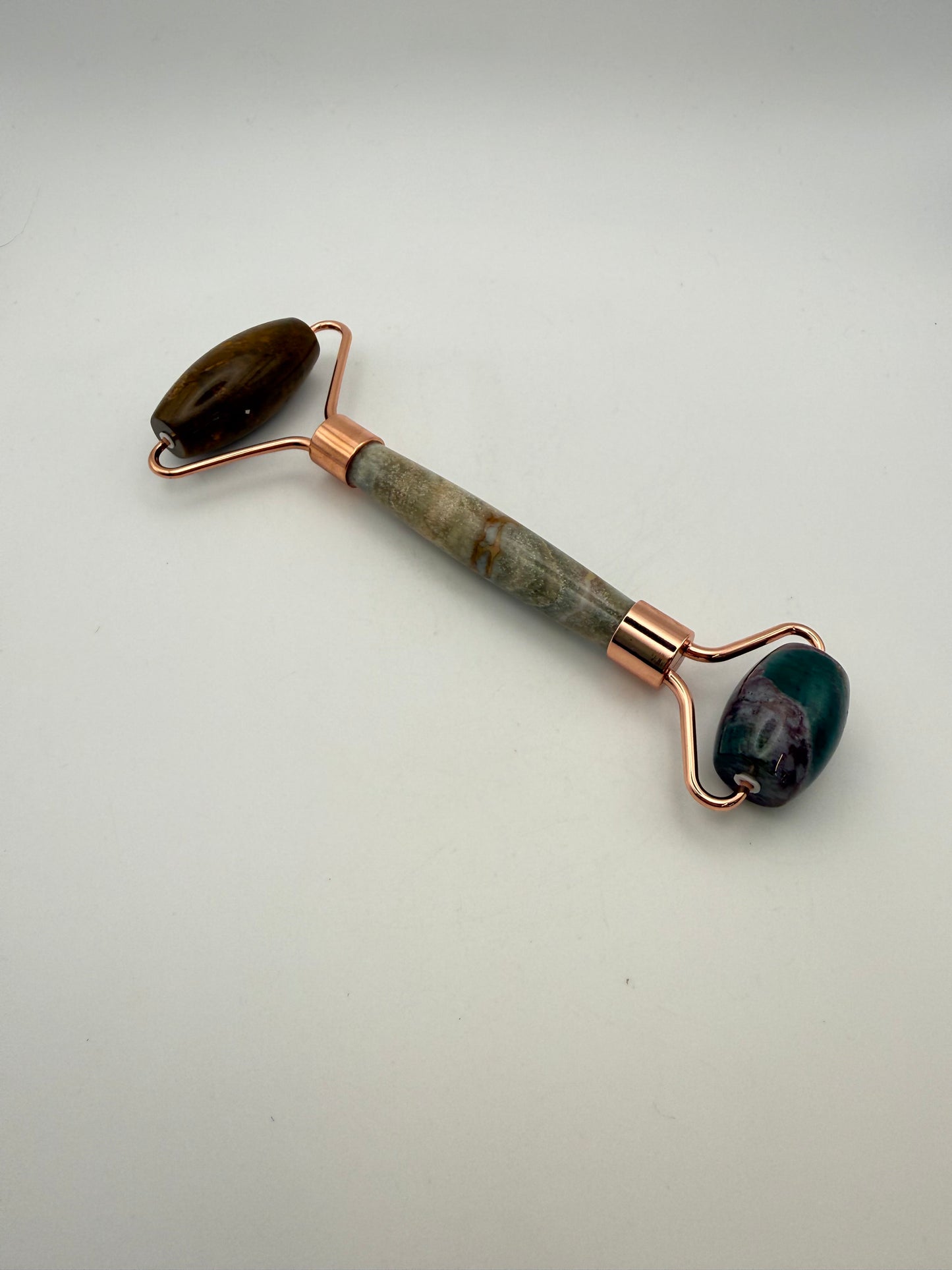 Massage roller made from ocean jasper stone.