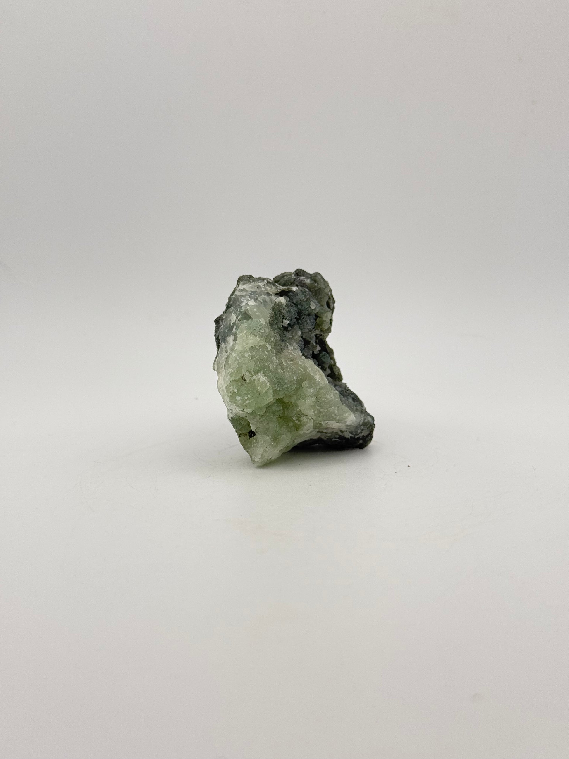 Raw Prehnite specimen with amazing green color.