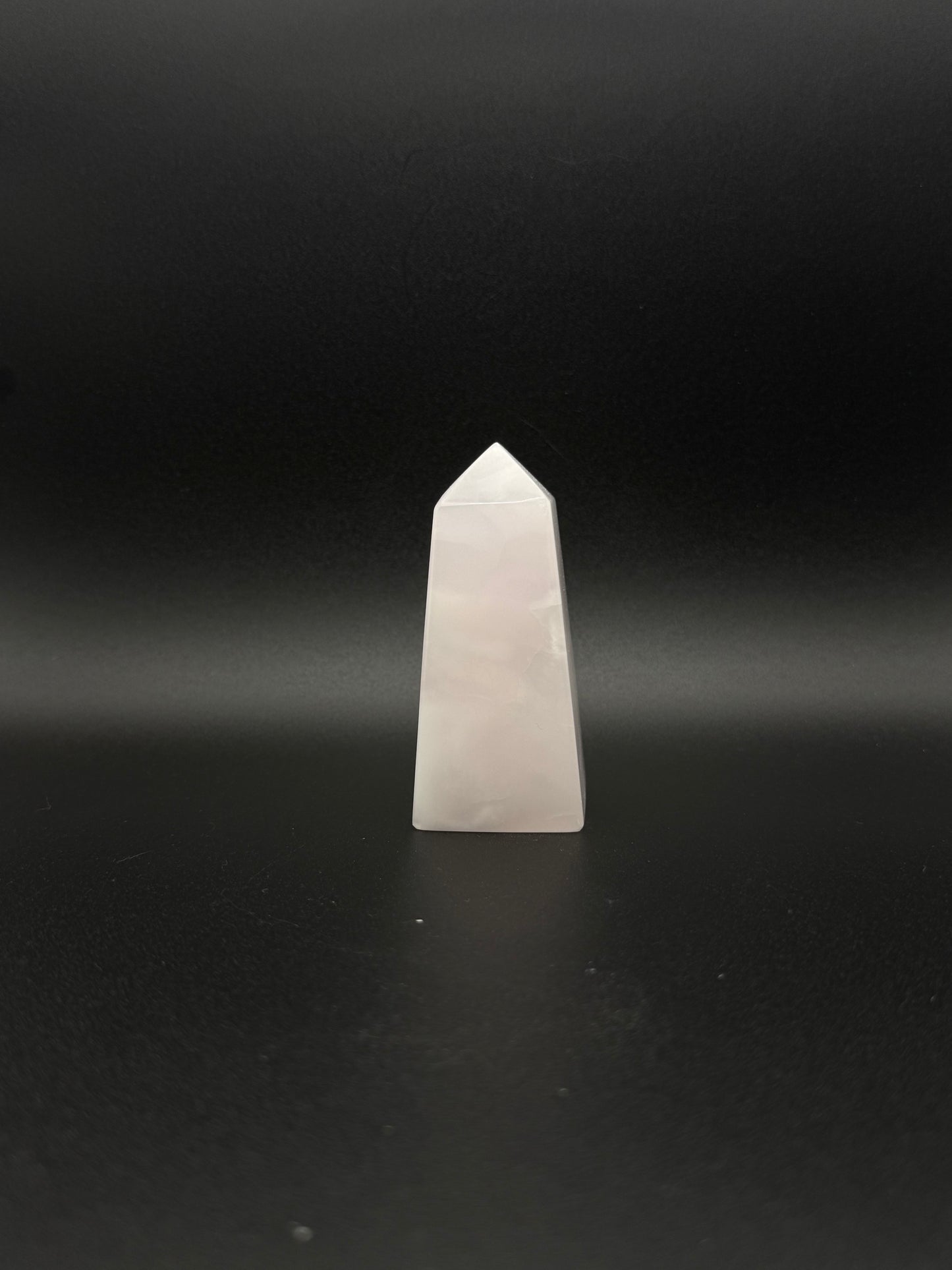 Polished pink calcite tower. Pink calcite glows under uv light.