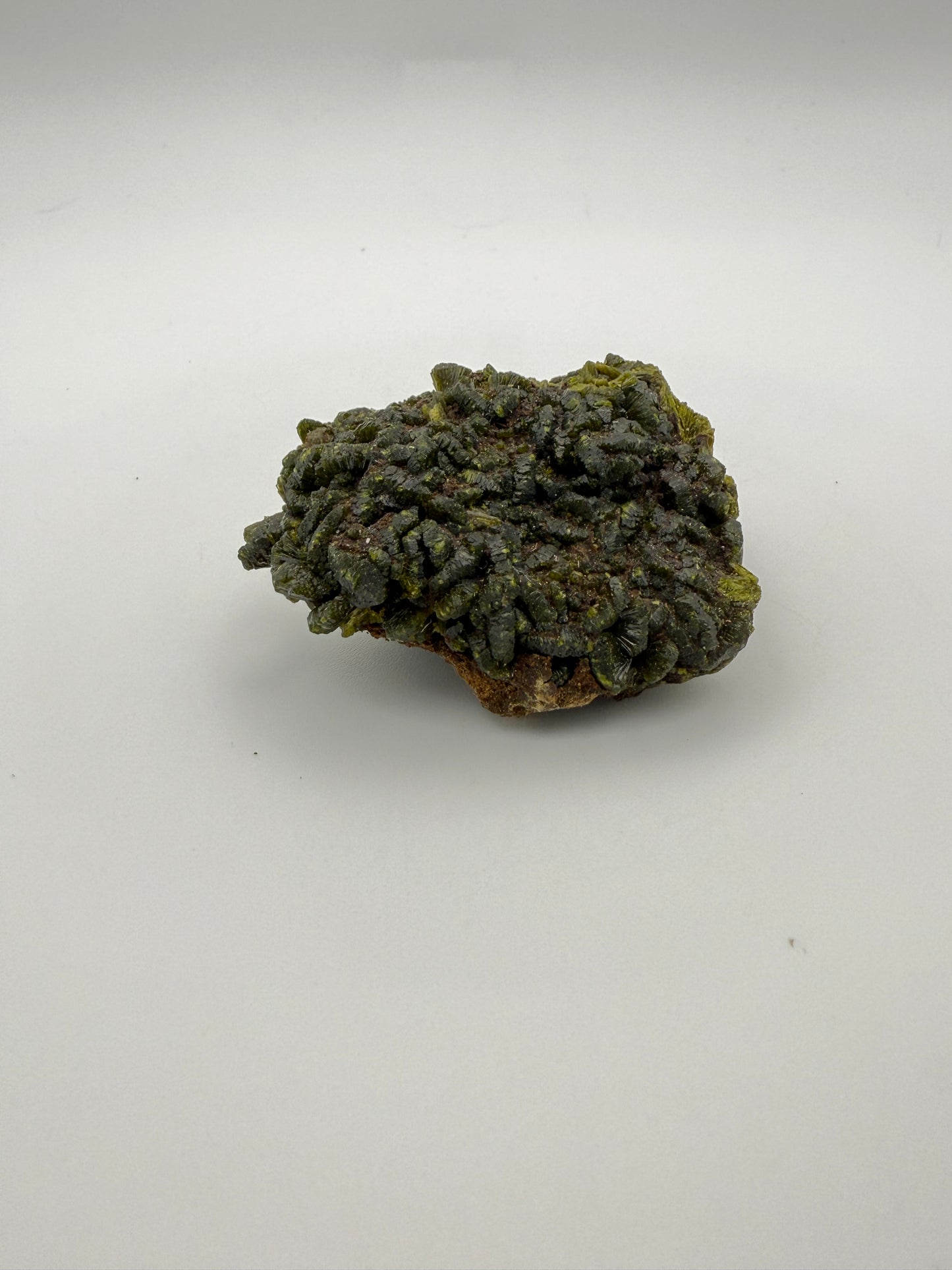 Epidote crystal cluster with good green color.