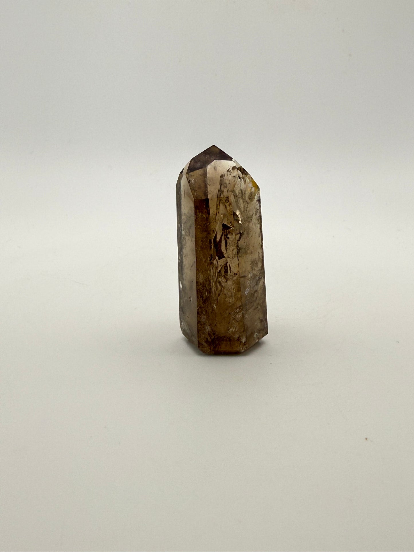 Polished natural citrine point.