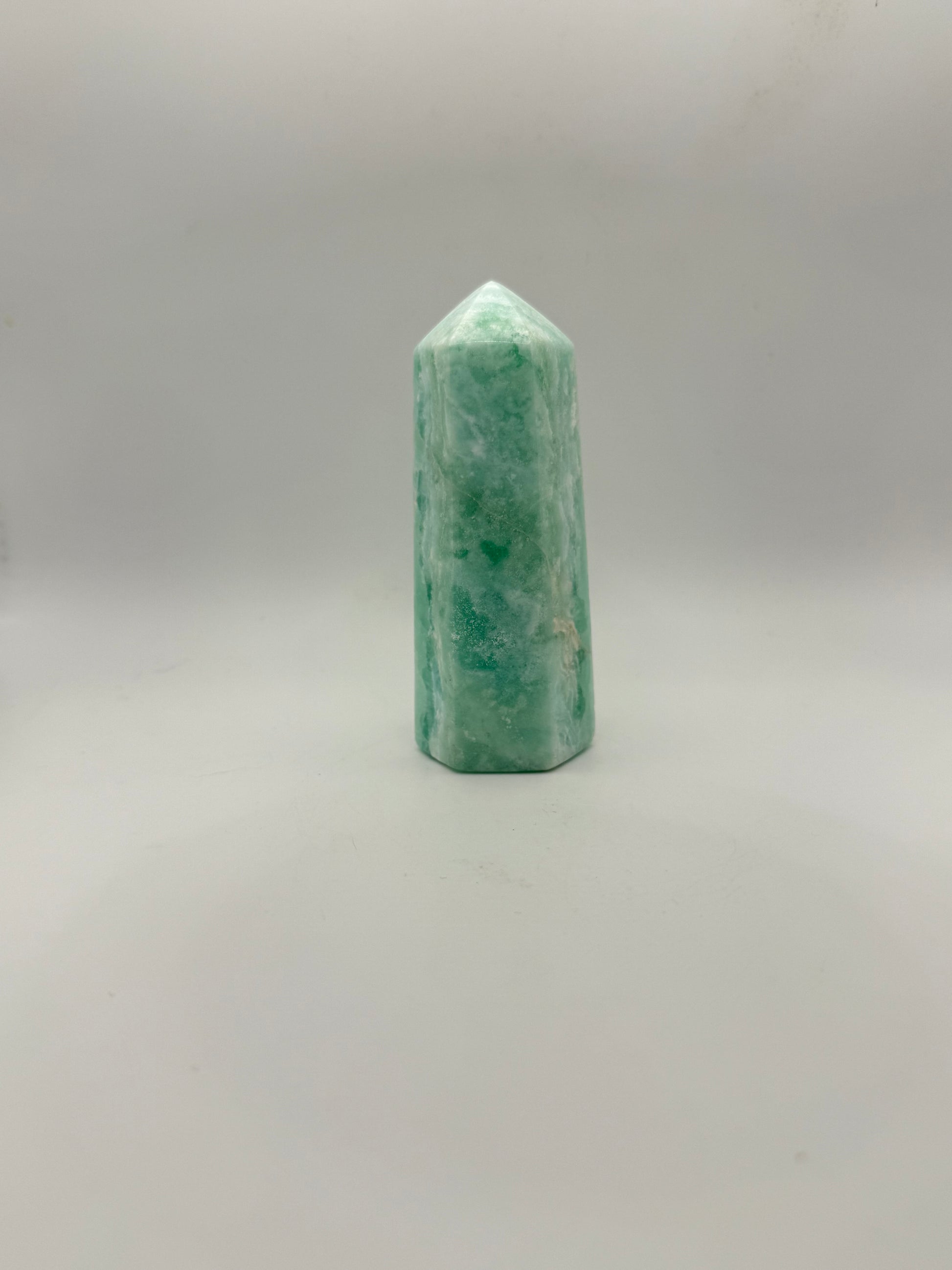 Caribbean Calcite polished six sided tower. A little over 4 inches tall.