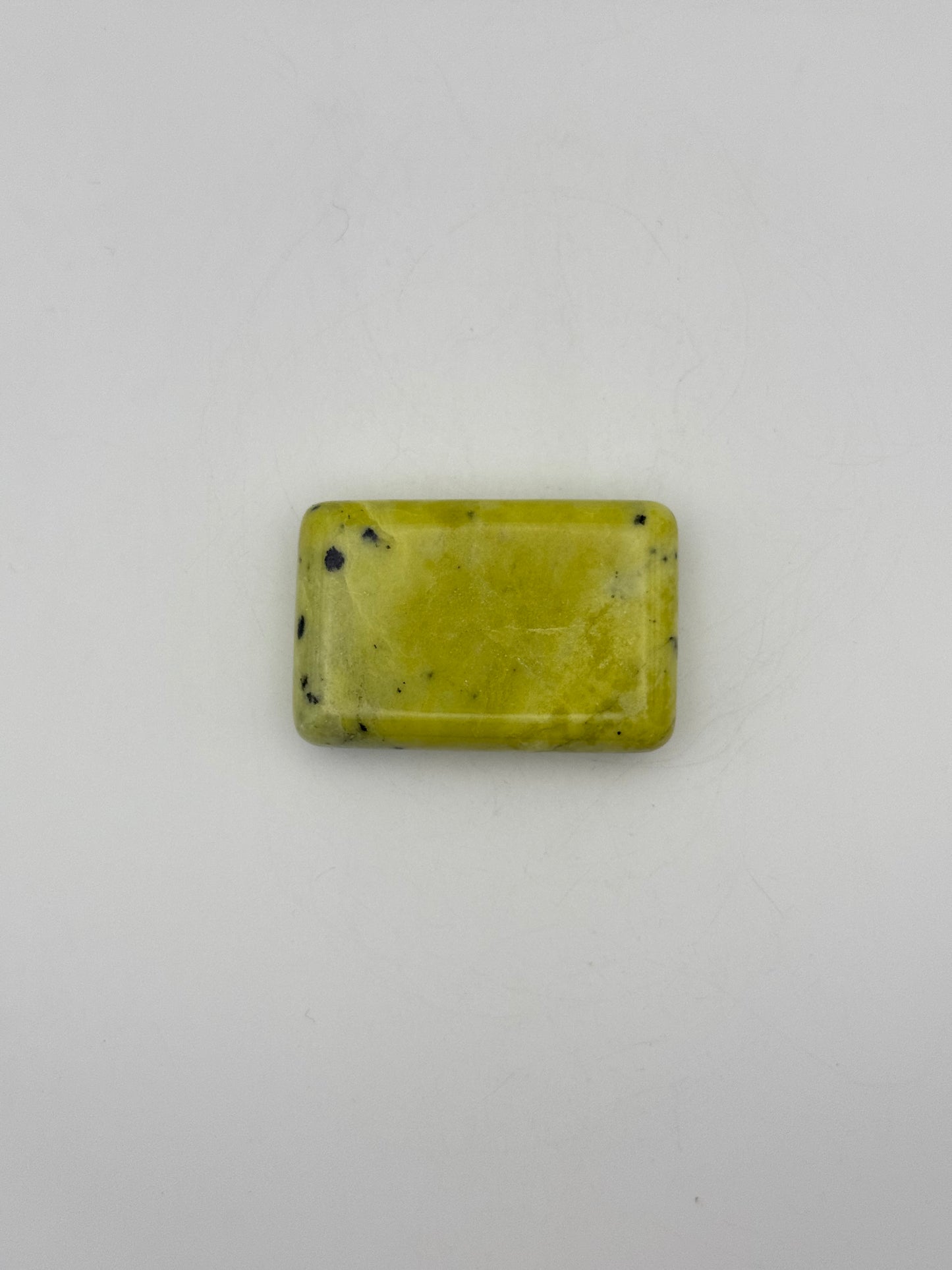 Polished healerite in the shape of a rectangular soap.