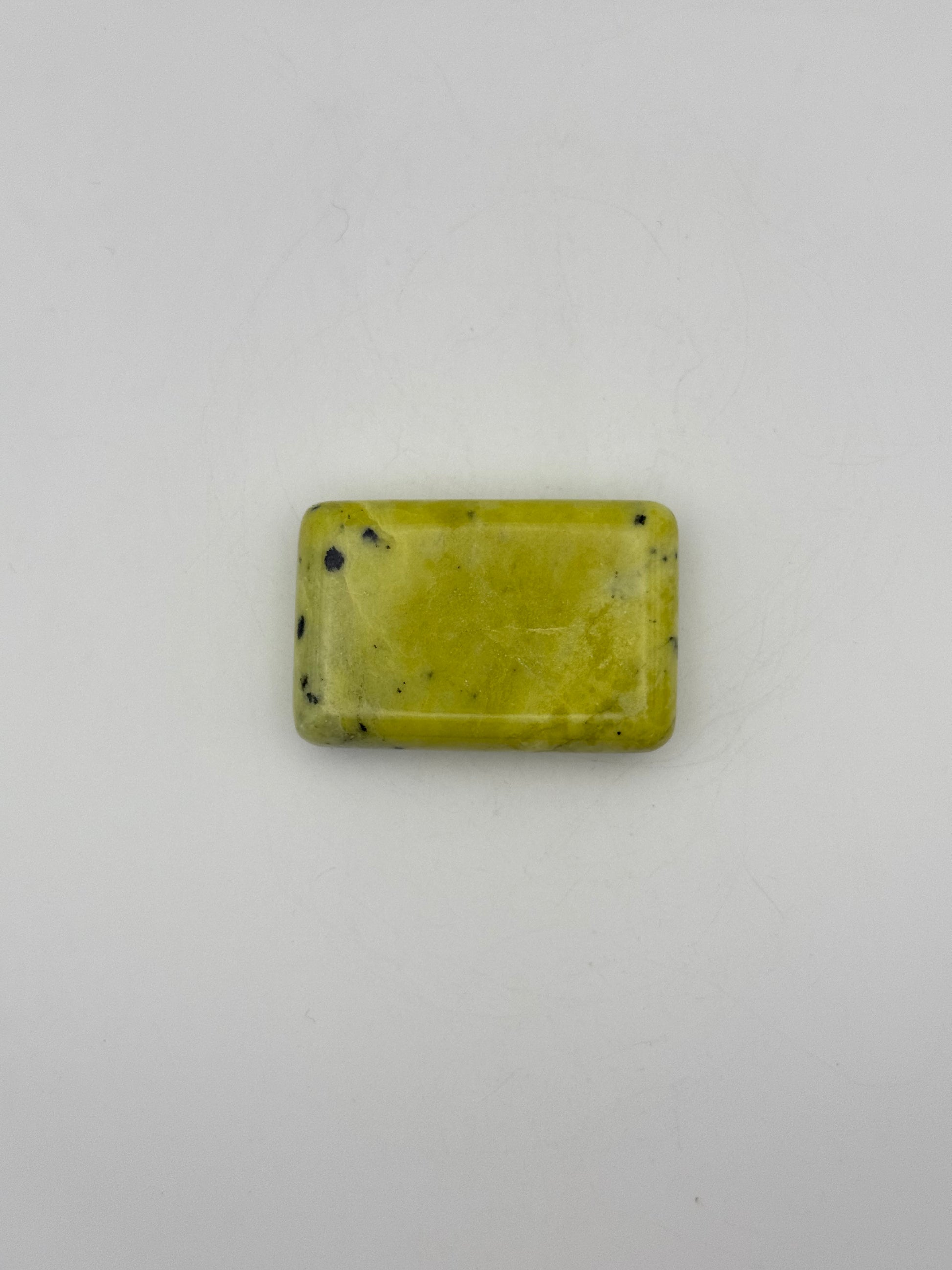 Polished healerite in the shape of a rectangular soap.