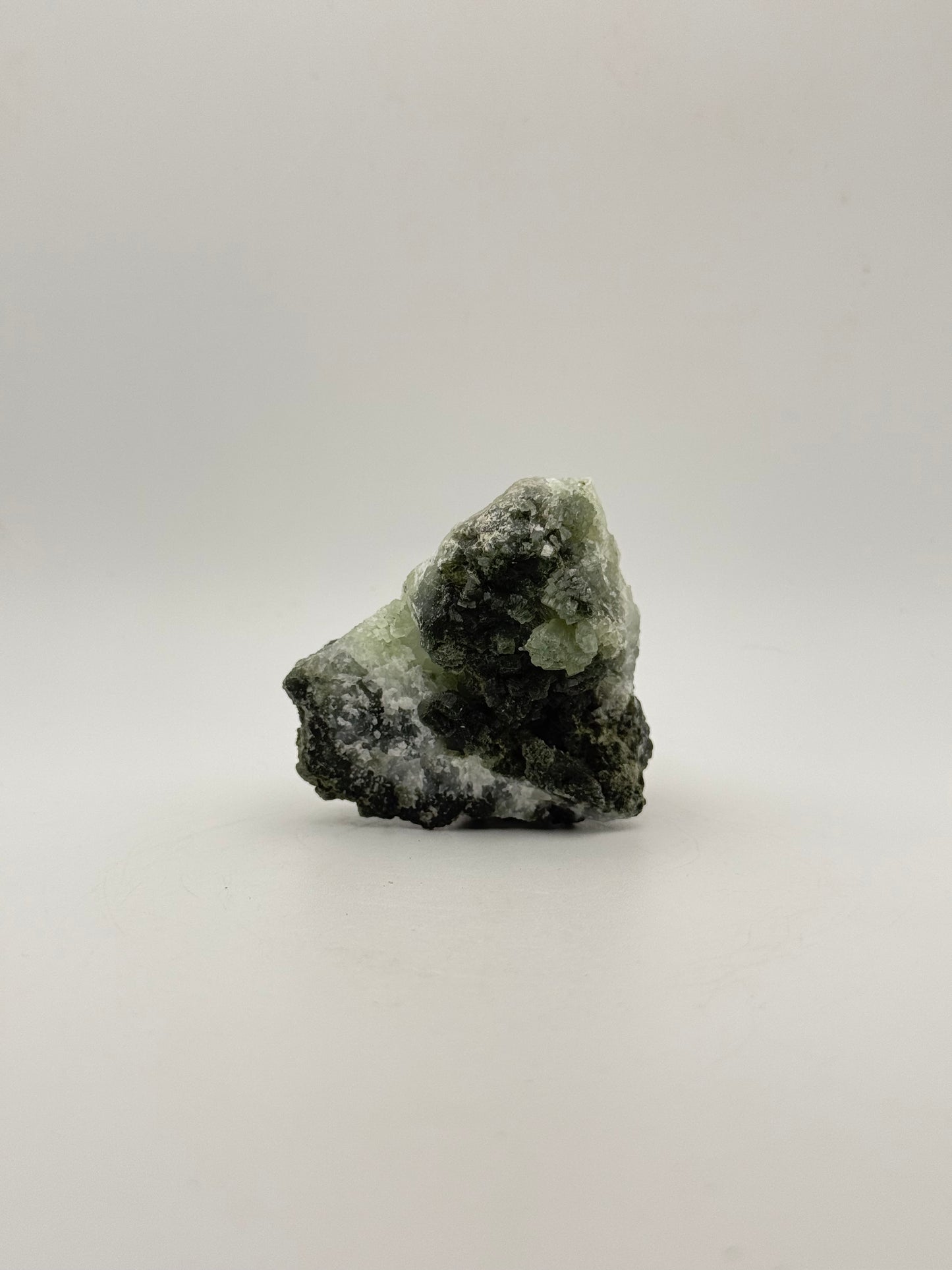 Raw Prehnite specimen with amazing green color.