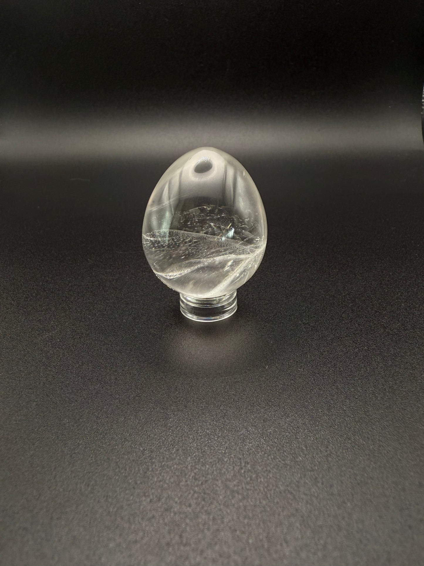 Clear quartz polished crystal in the shape of an egg.