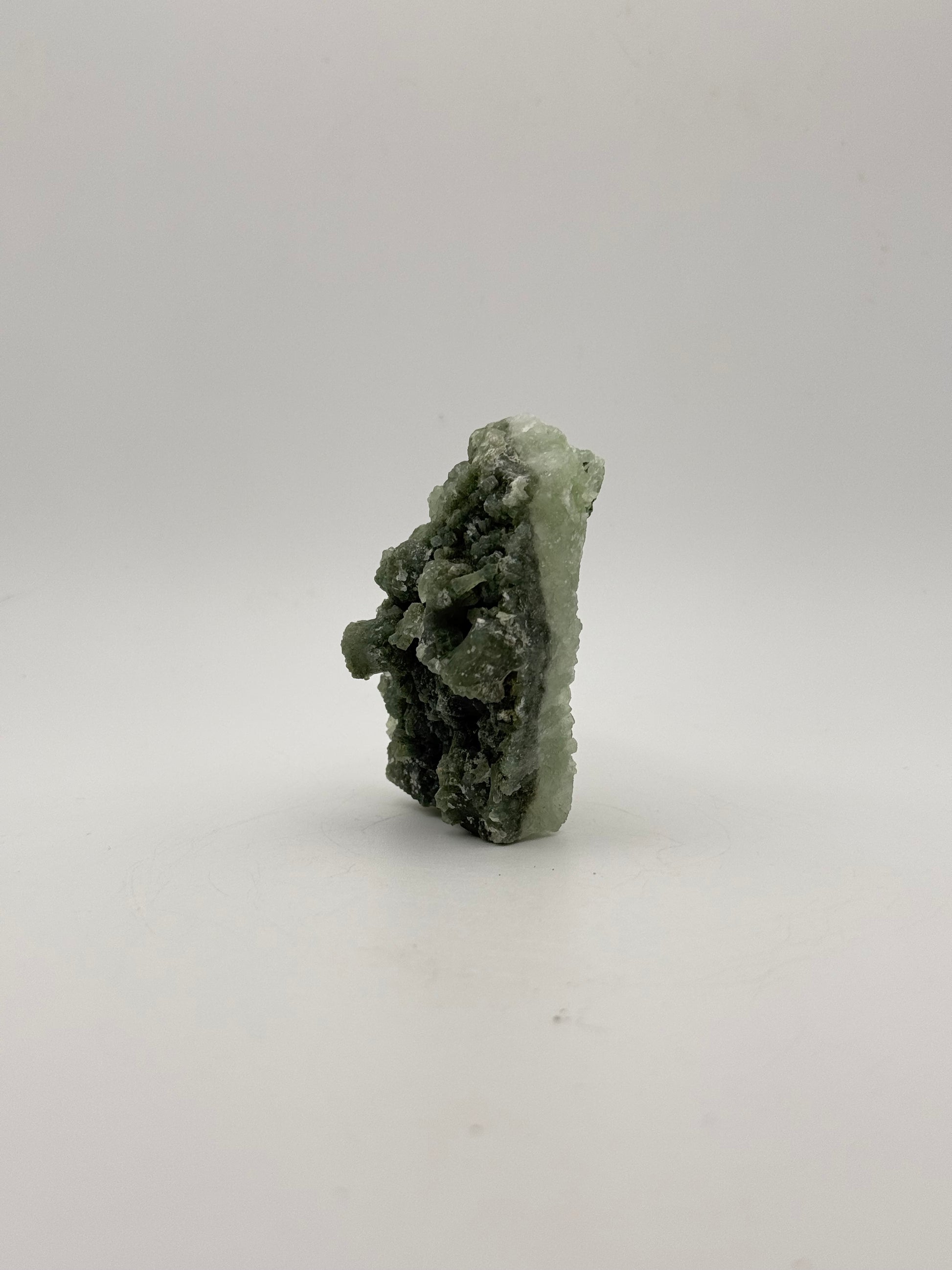 Raw Prehnite specimen with amazing green color.