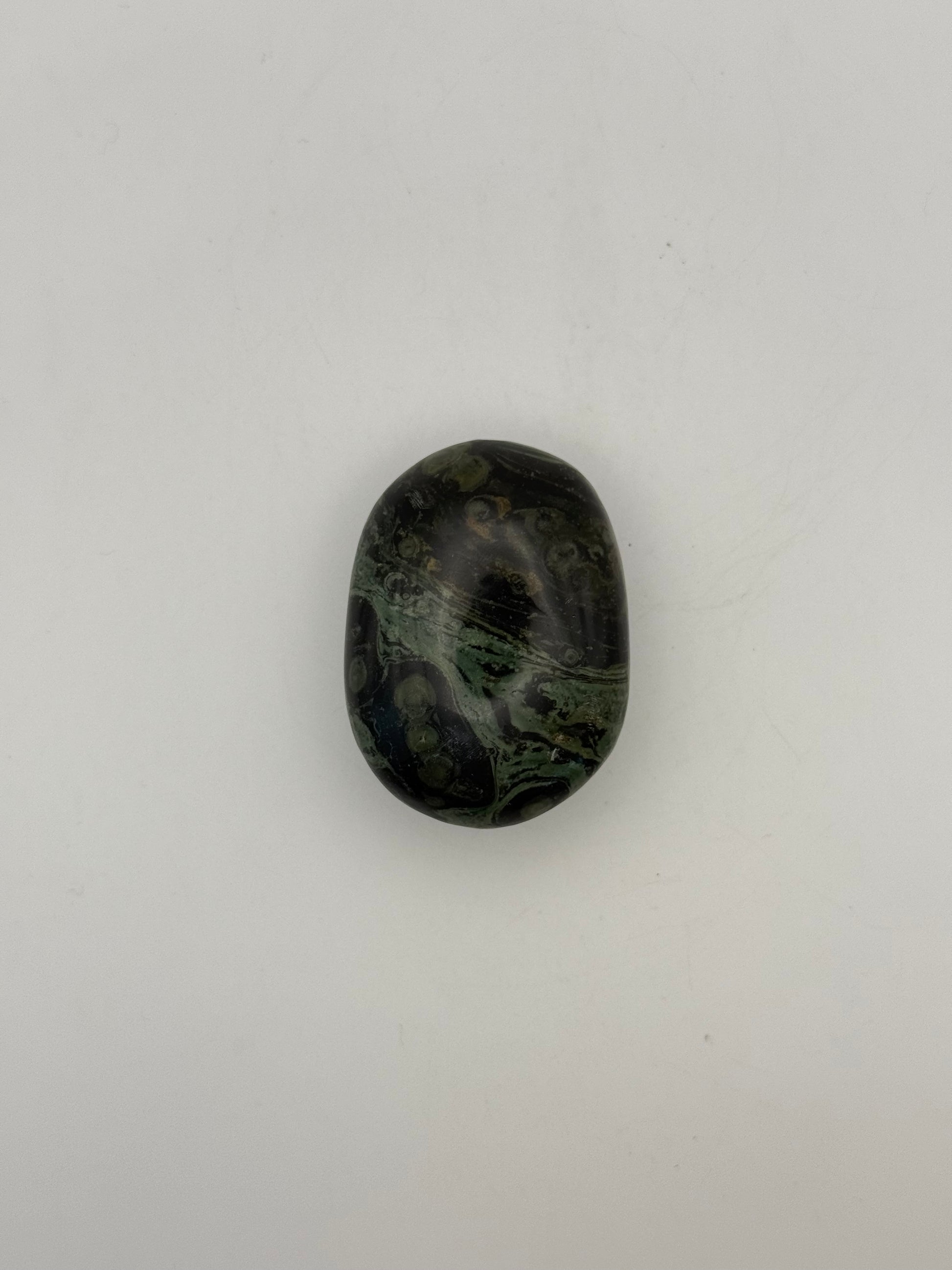 Polished kambaba jasper palm stone.