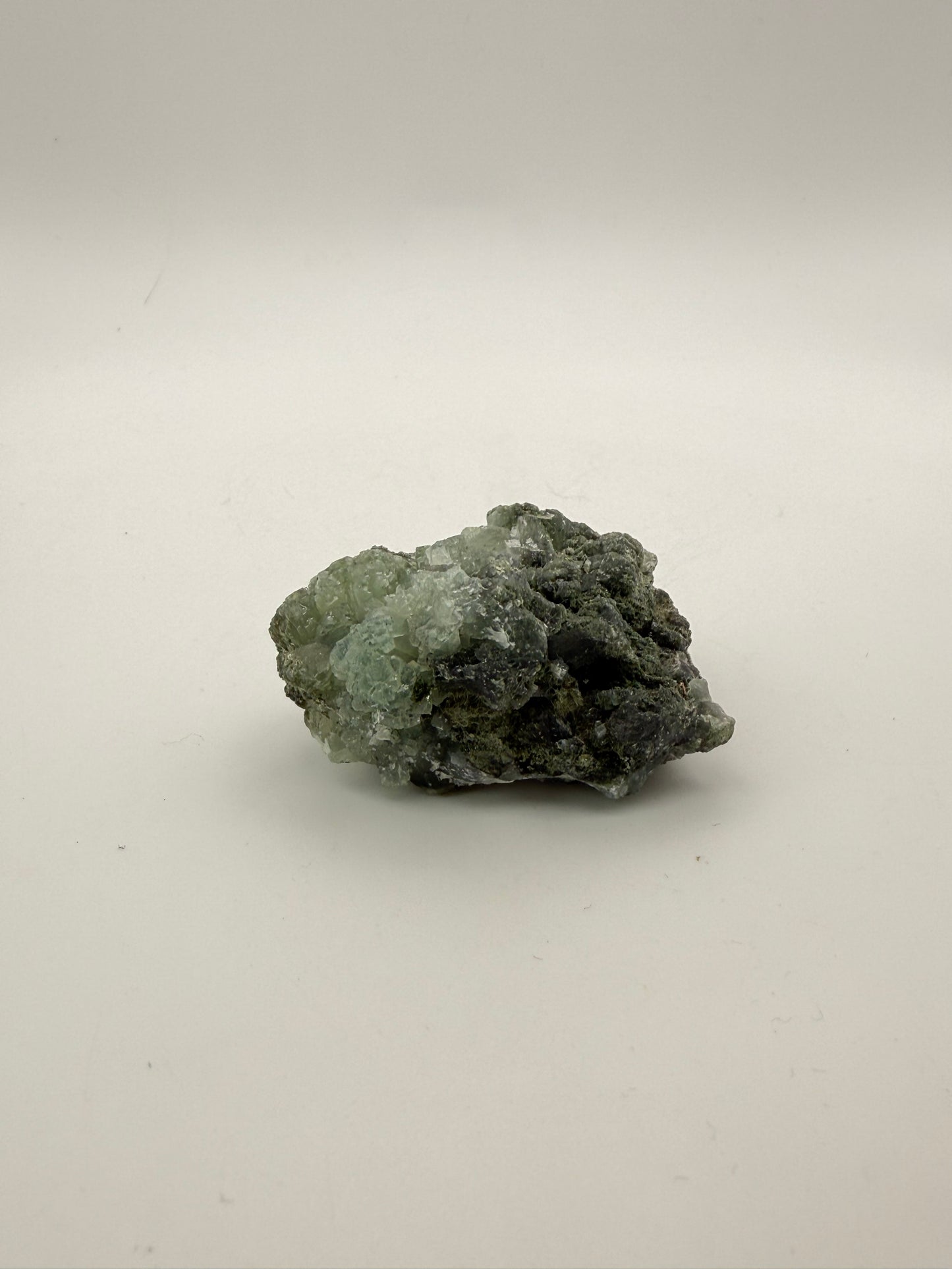 Raw Prehnite specimen with amazing green color.