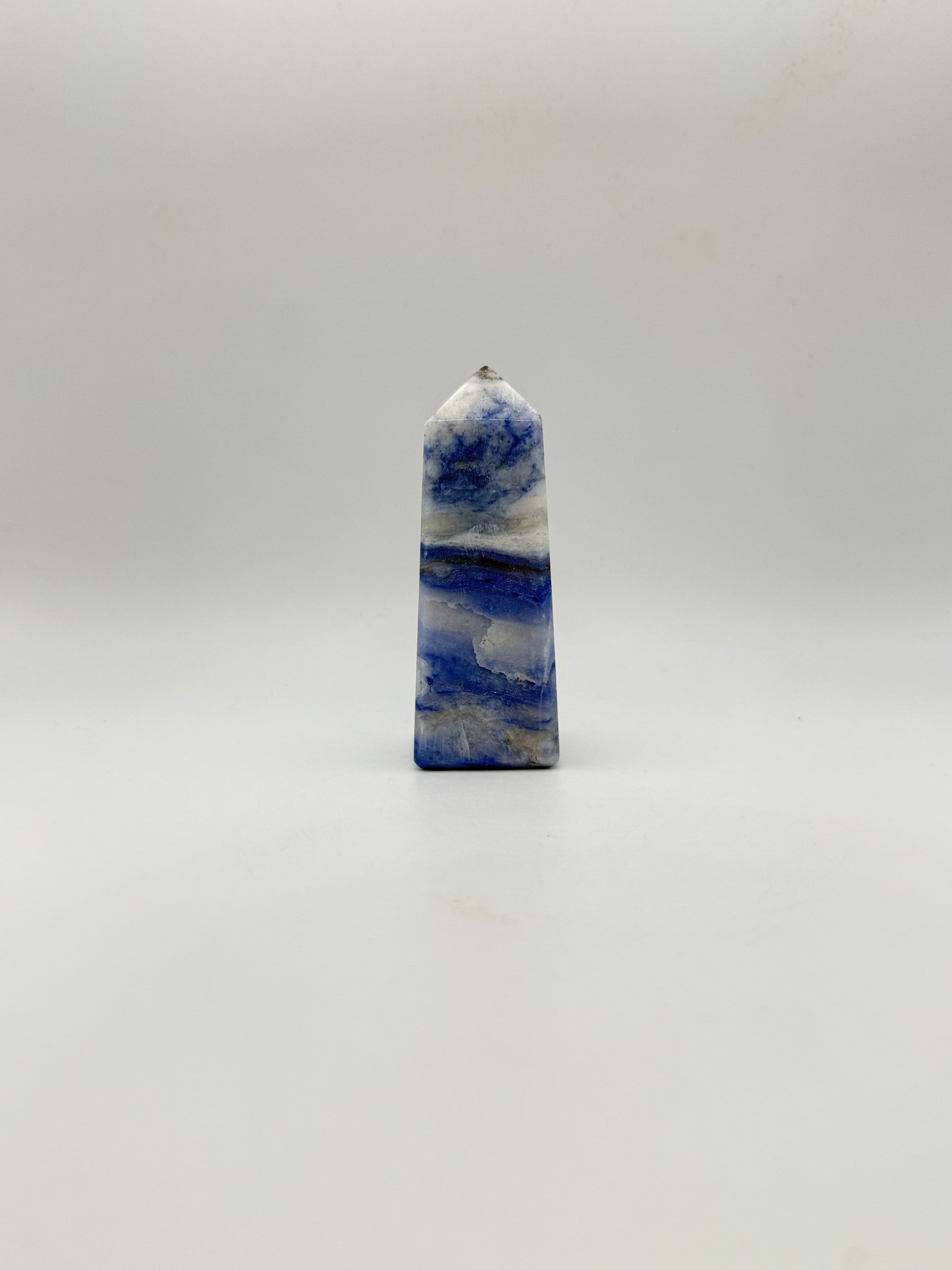 Afghanite four sided tower. Height of 3 1/4 inches, width of 1 1/4 inches.