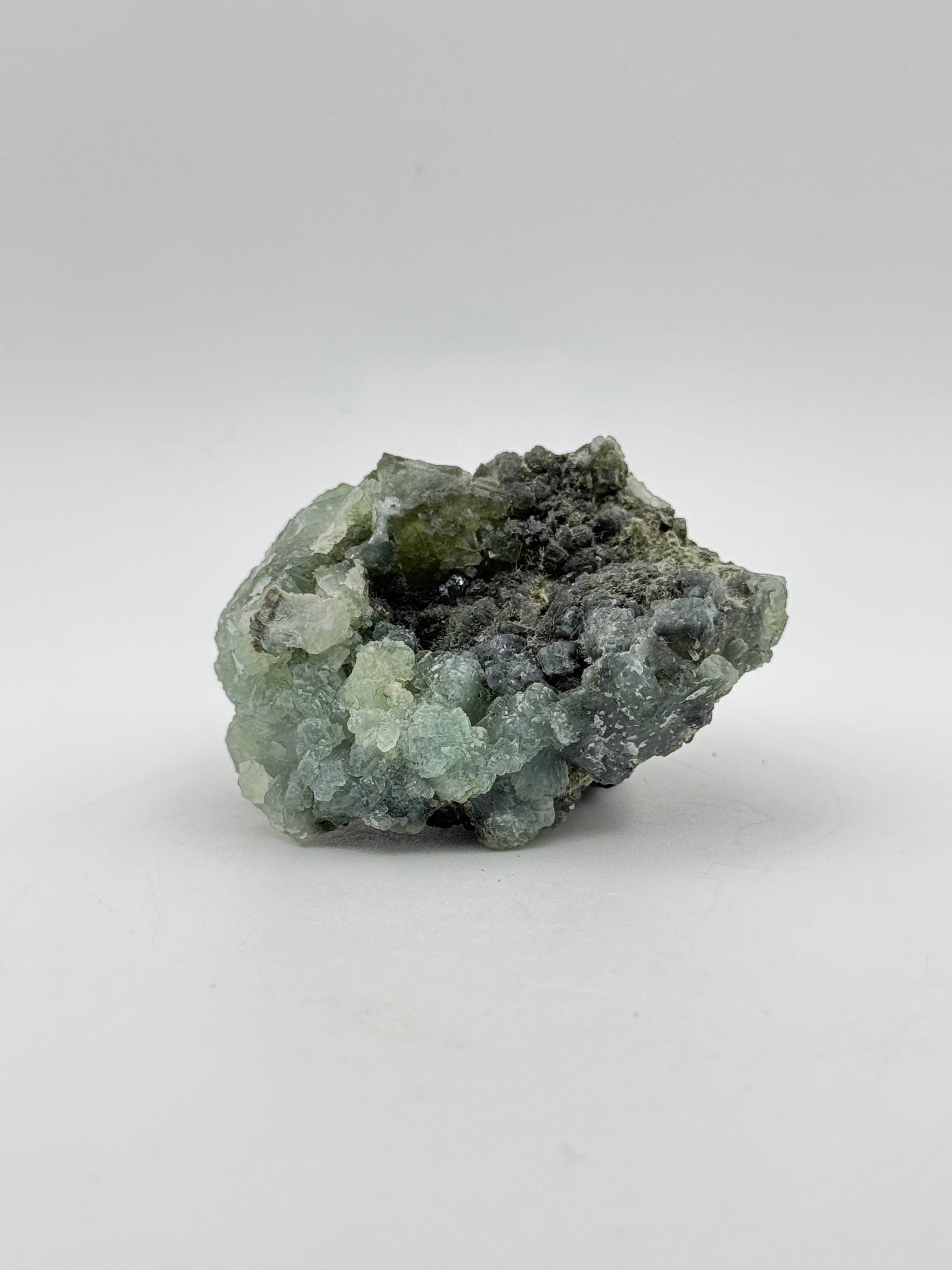 Raw Prehnite specimen with amazing green color.