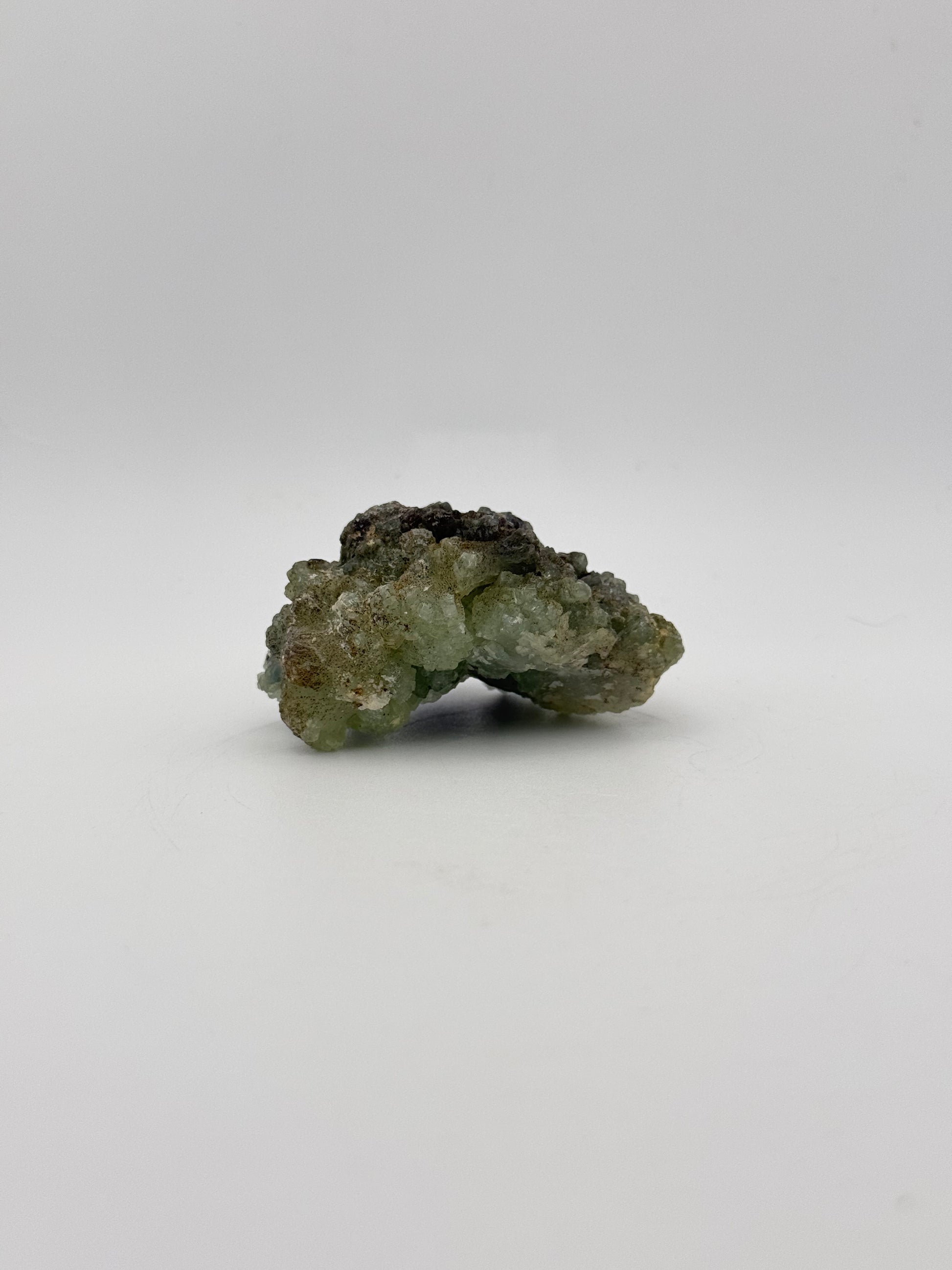 Raw Prehnite specimen with amazing green color.