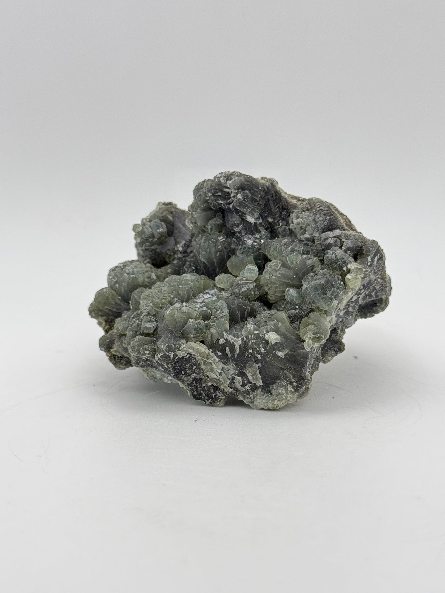 Raw prehnite specimen with amazing green color.