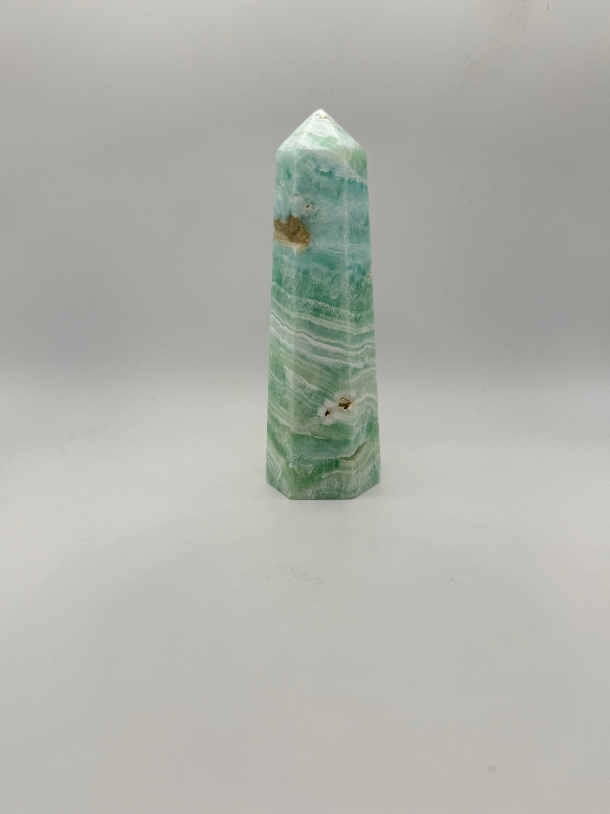 Caribbean Calcite polished six sided tower. This is 5.25 inches tall.