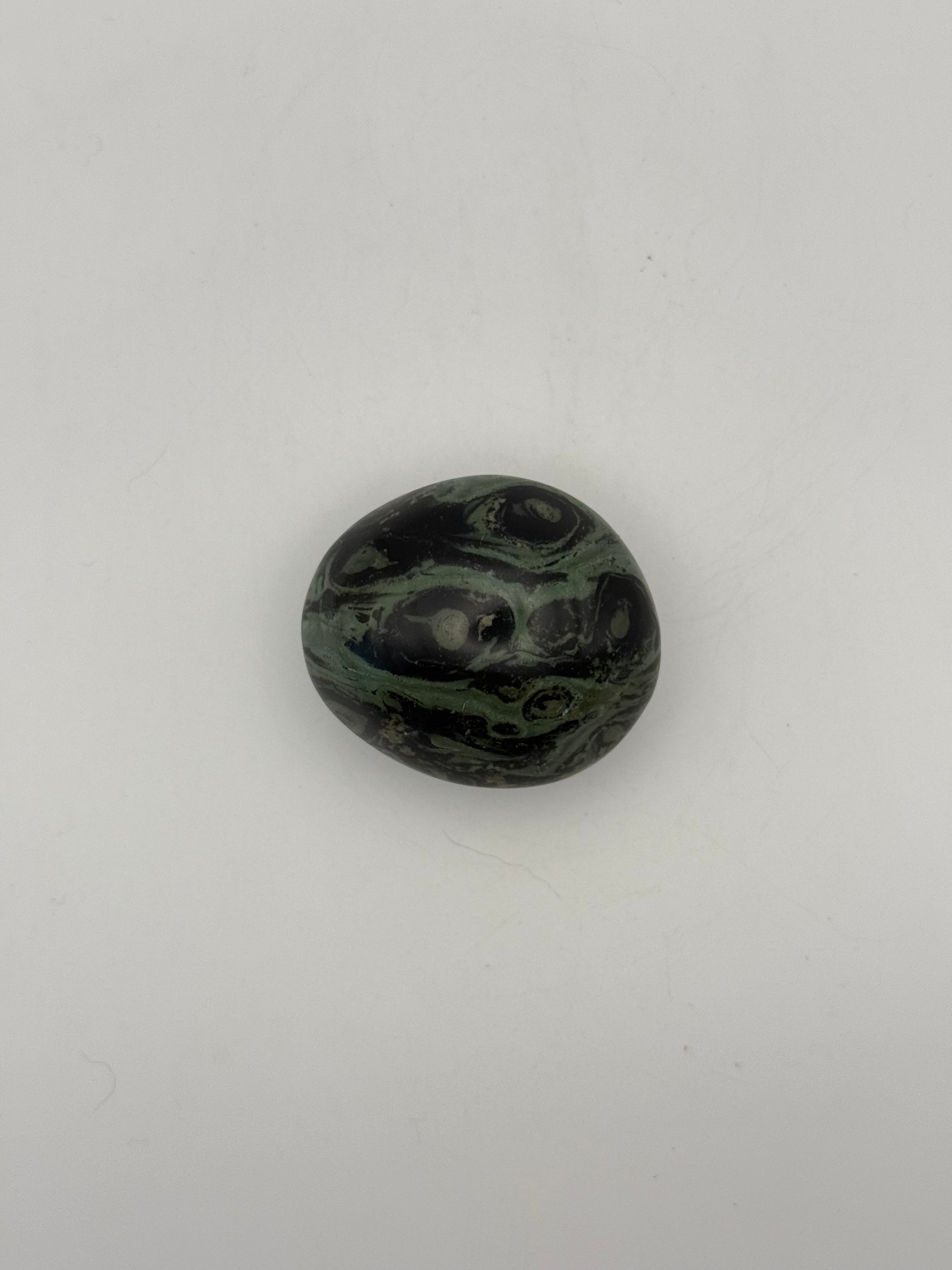 Polished kambaba jasper palm stone.