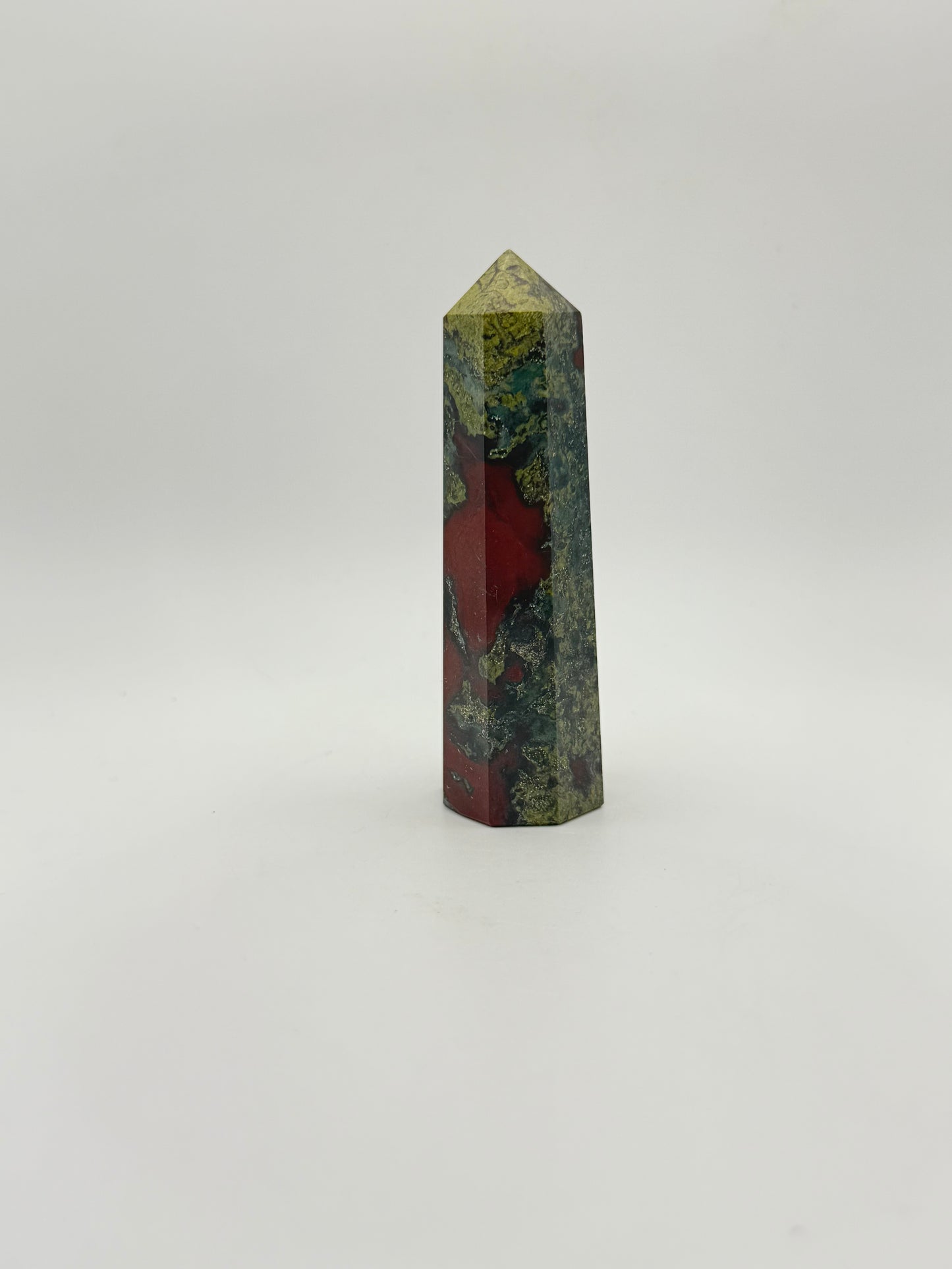 Polished Dragon Bloodstone in the shape of a tower.