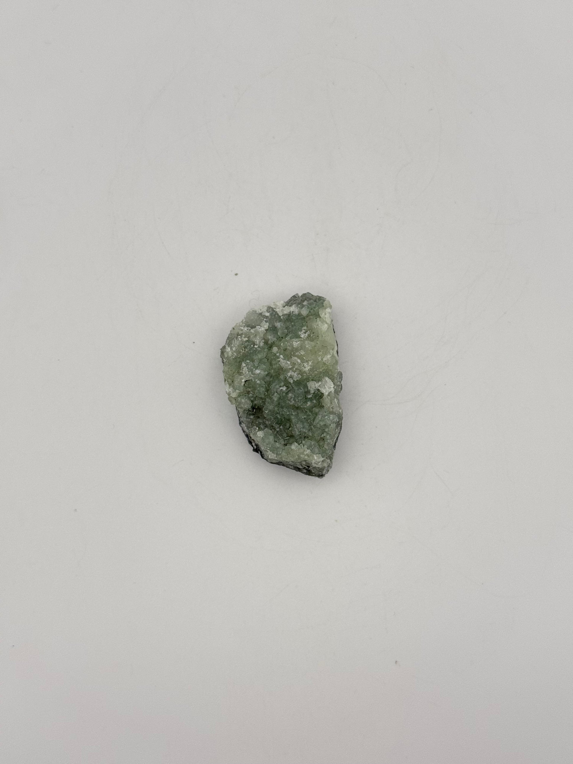 Raw Prehnite specimen with amazing green color.