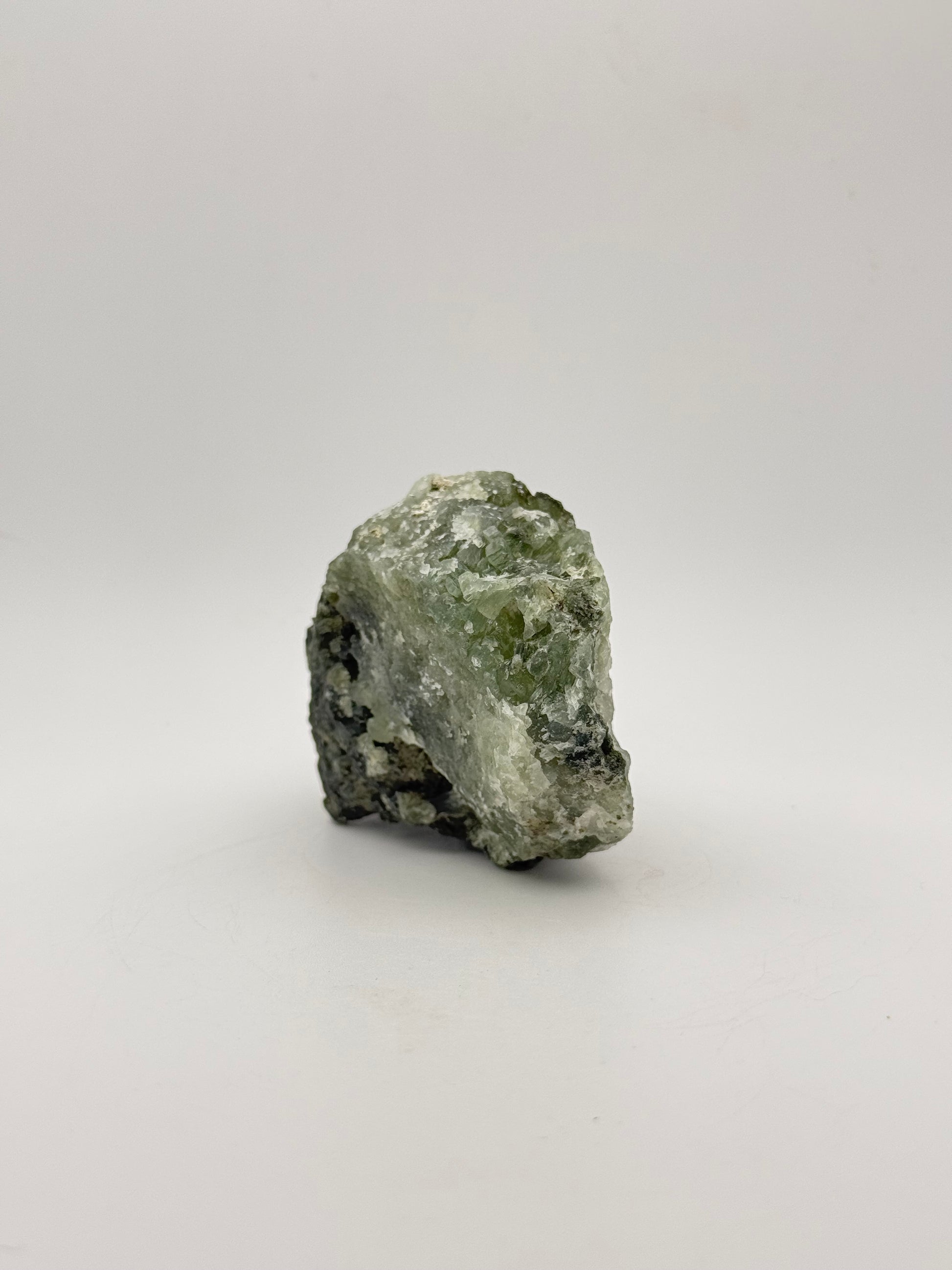 Raw Prehnite specimen with amazing green color.