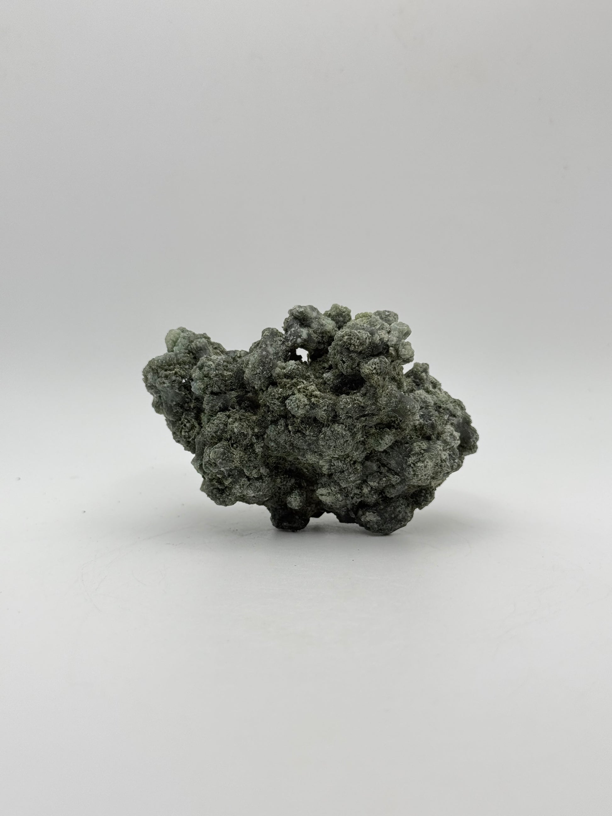 Raw prehnite specimen with amazing green color.