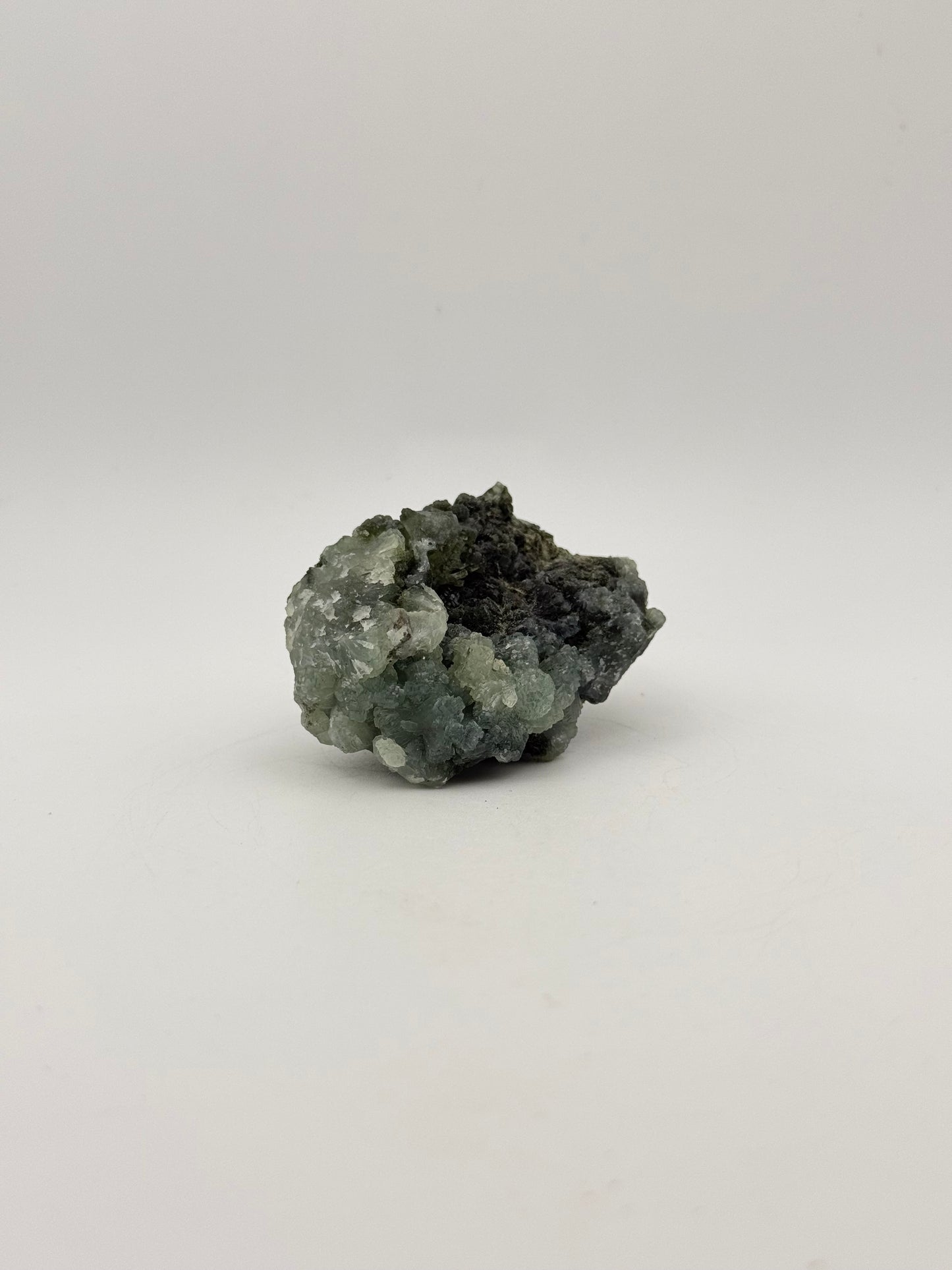 Raw Prehnite specimen with amazing green color.