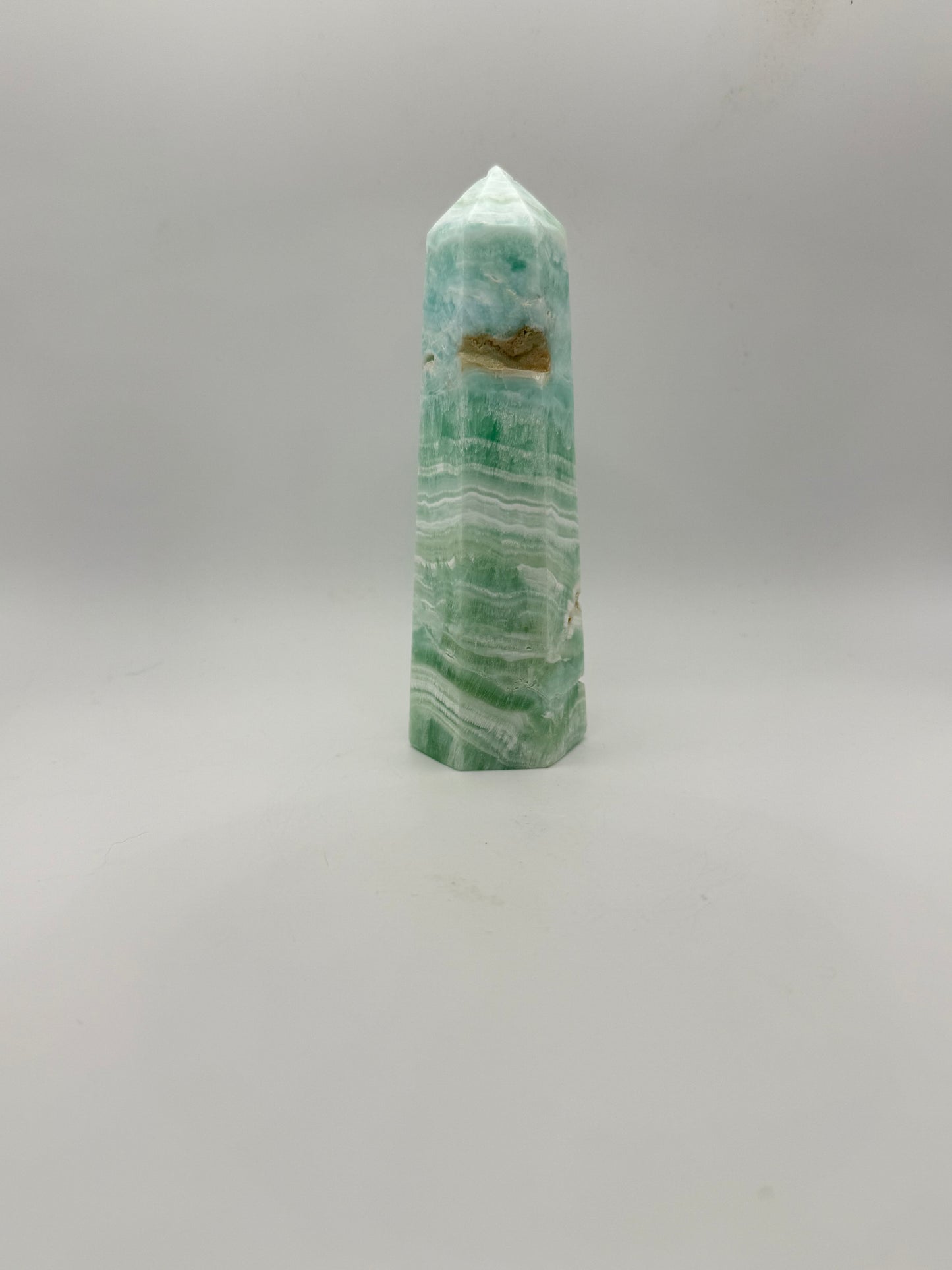 Caribbean Calcite polished six sided tower. This is 5.25 inches tall.